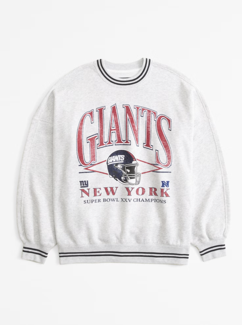 Gray New York Giants sweatshirt featuring "Giants" text and Super Bowl XXV Champions design with a helmet graphic.