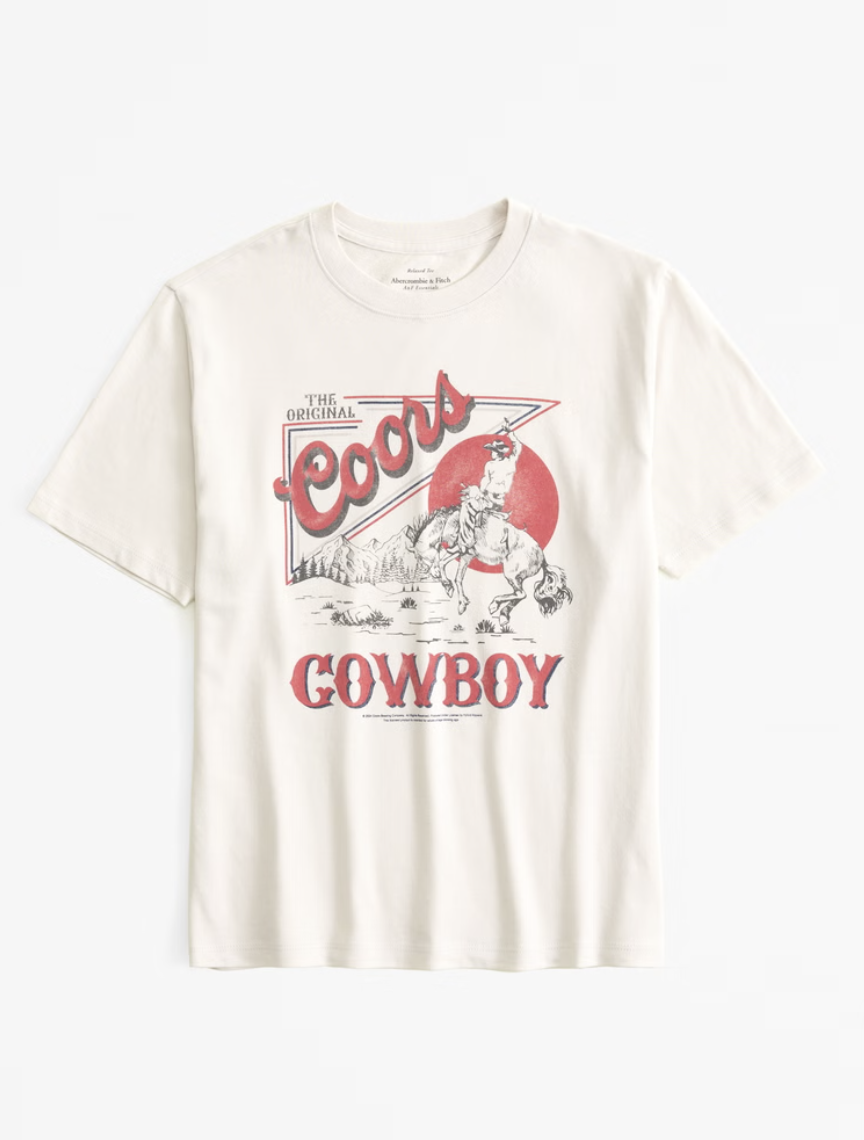 White t-shirt with Coors Cowboy graphic, featuring vintage cowboy and horse illustration, red and black text.