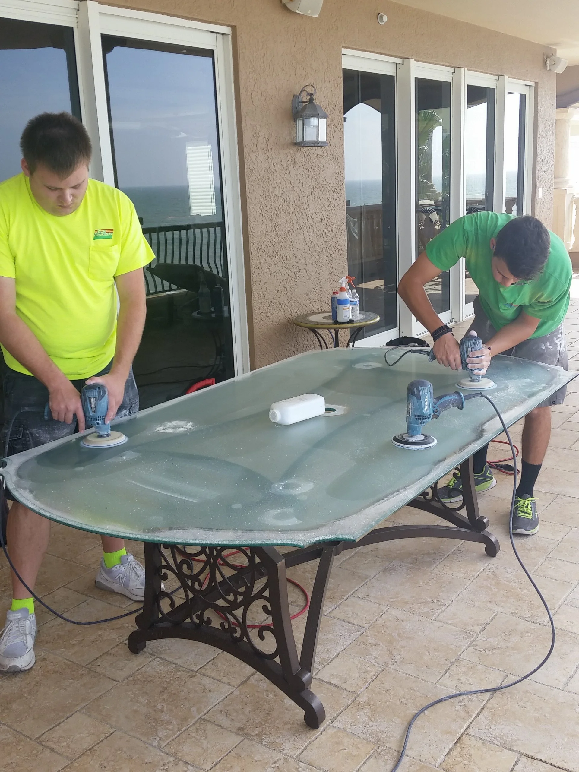 Glass Restoration Inc. technicians Stanton Barbas restoring a glass table — glass furniture and furnishings restoration in Sarasota County FL