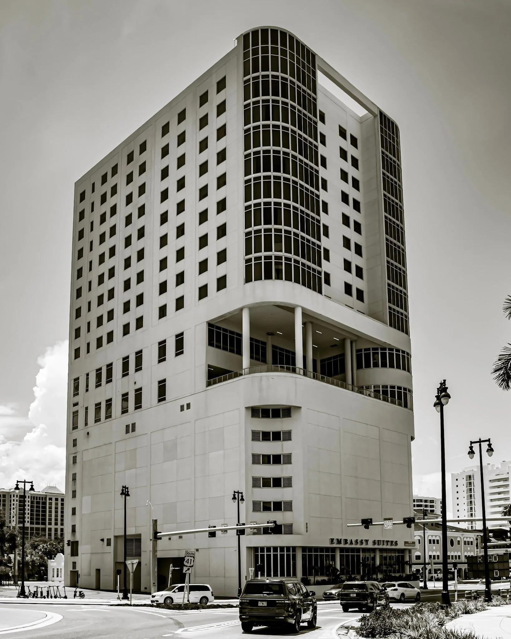 Waterfront glass restoration at Embassy Suites by Hilton Sarasota — Bay-facing suite windows and exterior glass restored on site by Glass Restoration Inc.