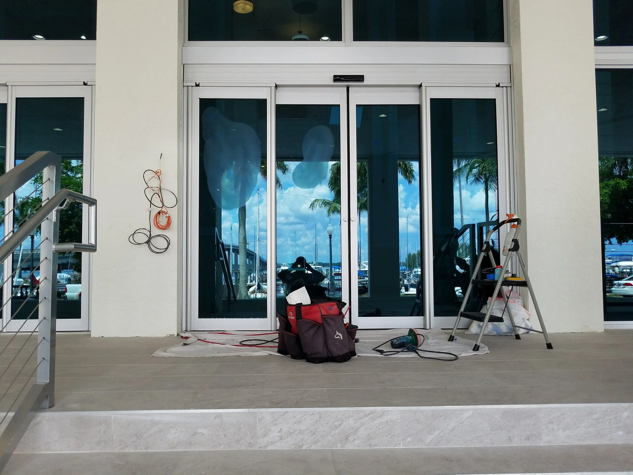 Curtain wall glass scratch restoration at Campo Felice Fort Myers
