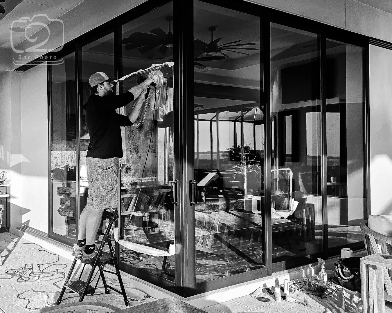 Glass Restoration Inc. technician restoring a new construction slider panel at Willow in Punta Gorda, Charlotte County, Florida.