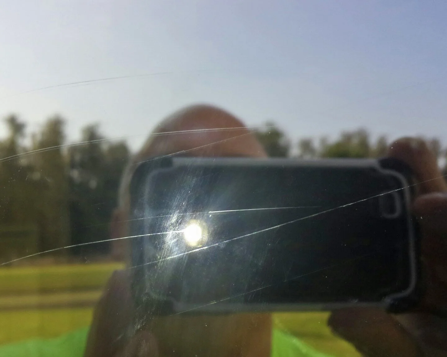 Cell phone image with flash illuminating the scratches