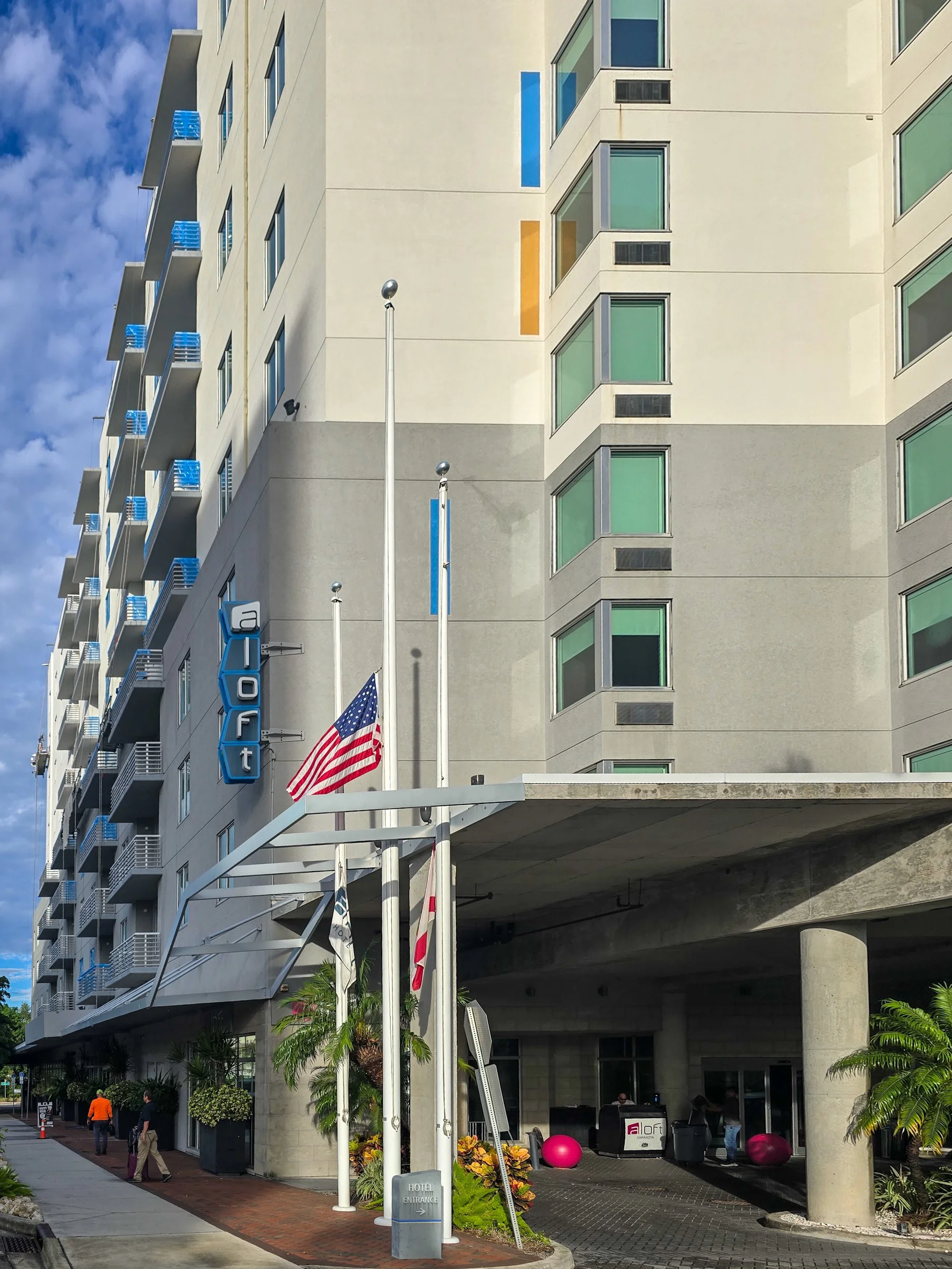 Exterior of the Aloft Sarasota hotel, a Marriott-brand property where Glass Restoration Inc. restored storefront glass other companies couldn't repair — the same artisan-level trust architects and estate builders rely on