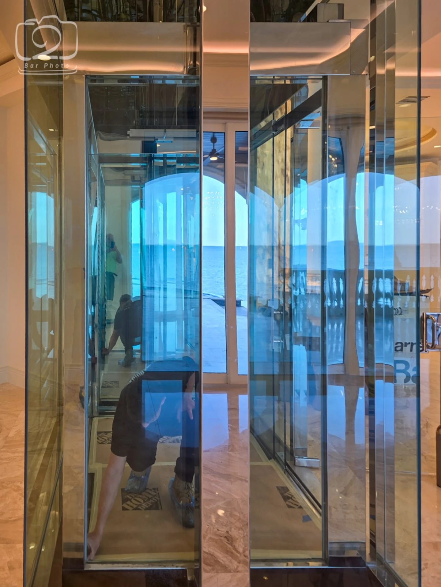 Taking transparency to new heights! ✨ Skyler keeping things running smoothly in our stunning glass elevator. Nothing beats a view from the inside looking out. 🏢🔮#CustomHomeBuilder #LuxuryHomeDesign #GlassElevator #HomeElevator #CustomBuild