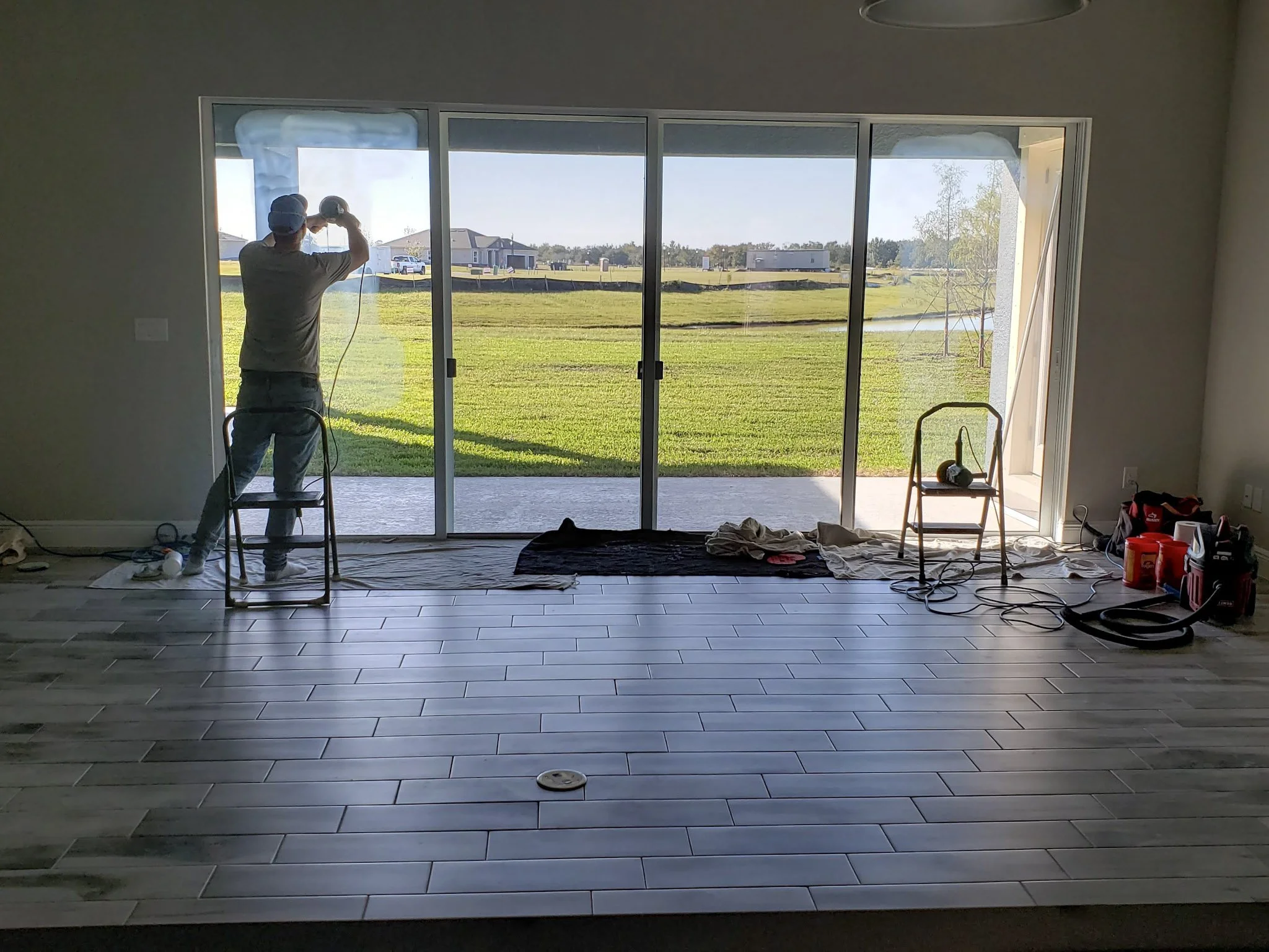 Lanai slider scratch repair at a Tucker's Cove home in Babcock Ranch — Glass Restoration Inc. on-site artisan restoration, Charlotte County Florida.