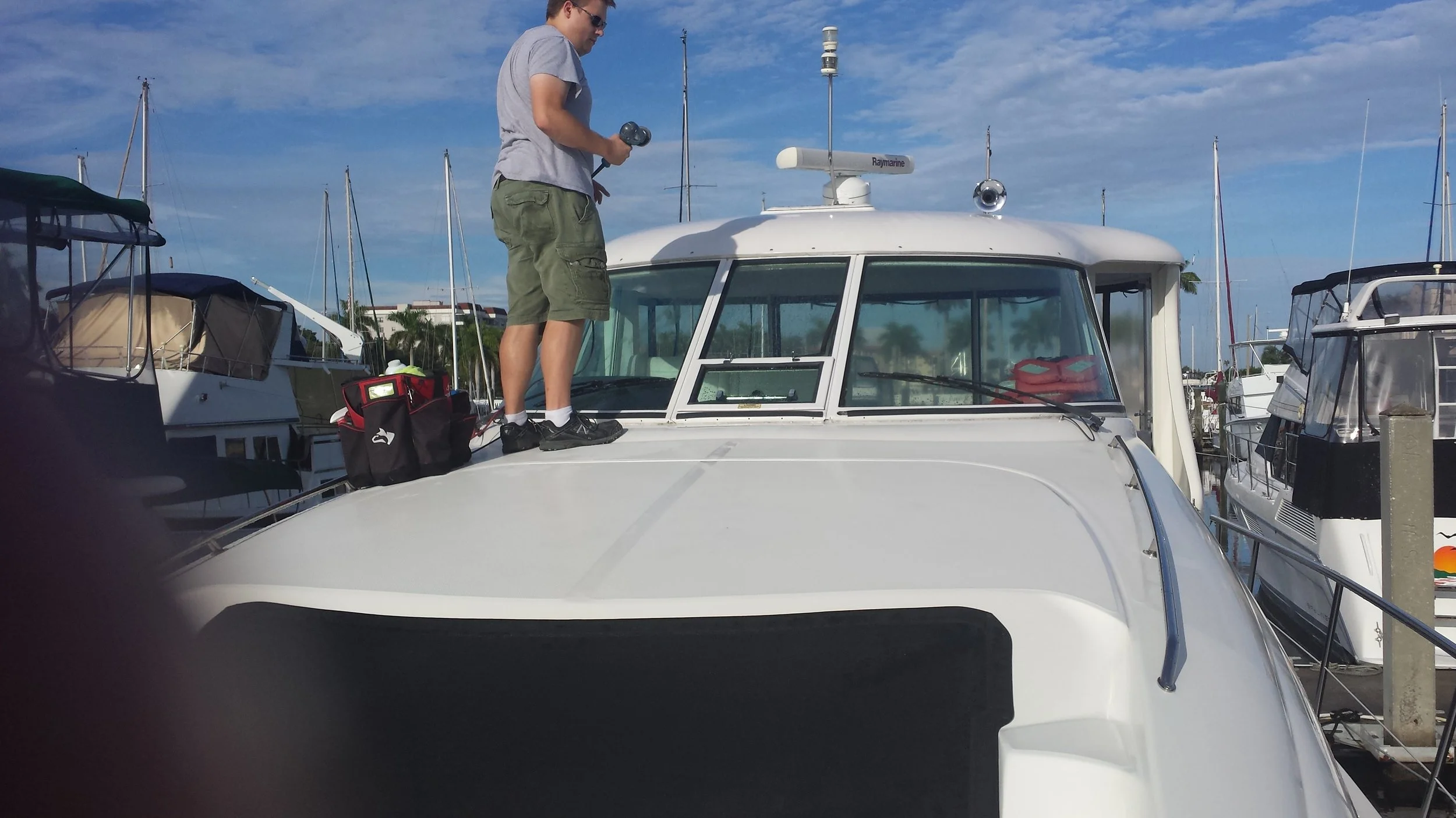 Glass Restoration Inc. crew restoring yacht glass on site at Galati Yachts, trusted marine glass restoration partner