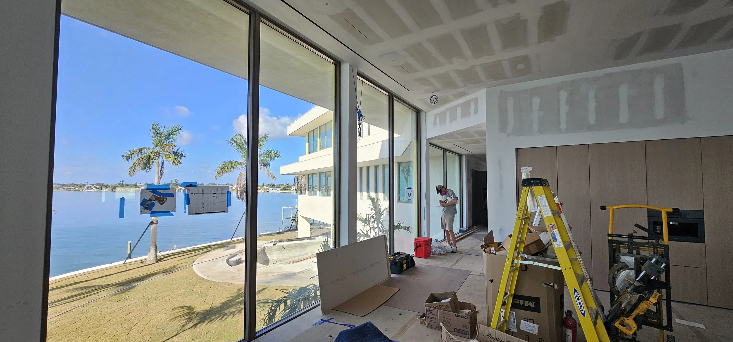 Glass scratch repair on floor-to-ceiling hurricane glass at Aqua Sarasota, Golden Gate Point, downtown Sarasota FL — Glass Restoration Inc.