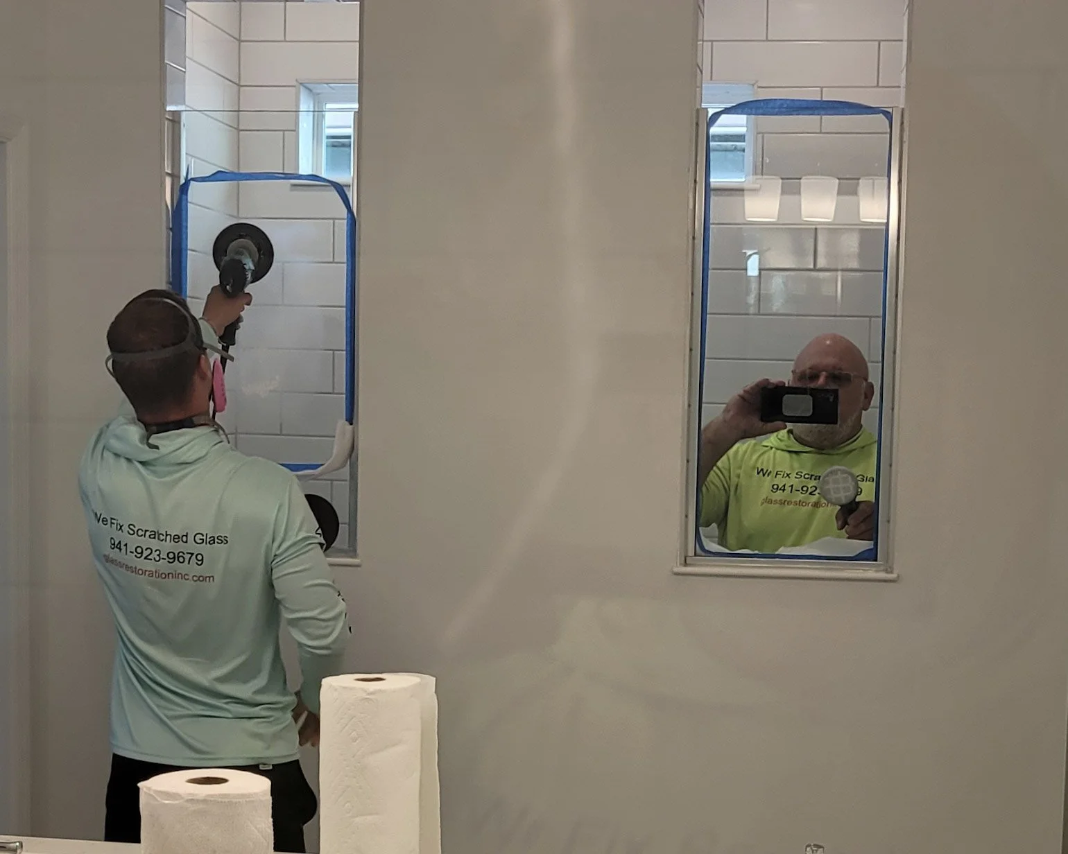 The Glass Restoration Inc. team at work: using a multi-stage polishing process to eliminate permanent water spots and scratches to restore factory-clear brilliance to a custom walk-in shower in Talon Preserve located at Nokomis FL.