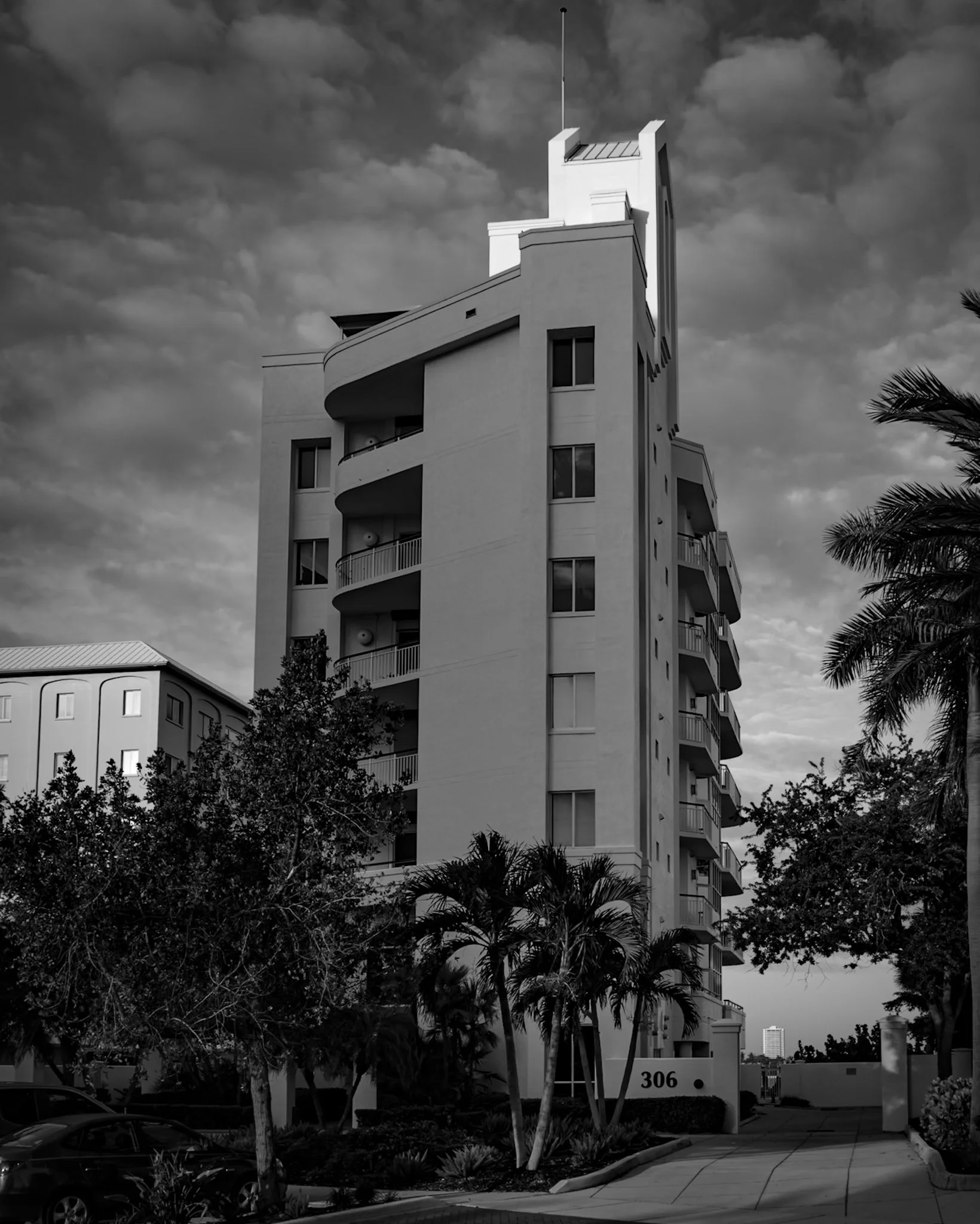 Alta Mer at 306 Golden Gate Point Sarasota — six full-floor residences with walls of glass, bay views, and private boat docks, glass scratch repair by Glass Restoration Inc.