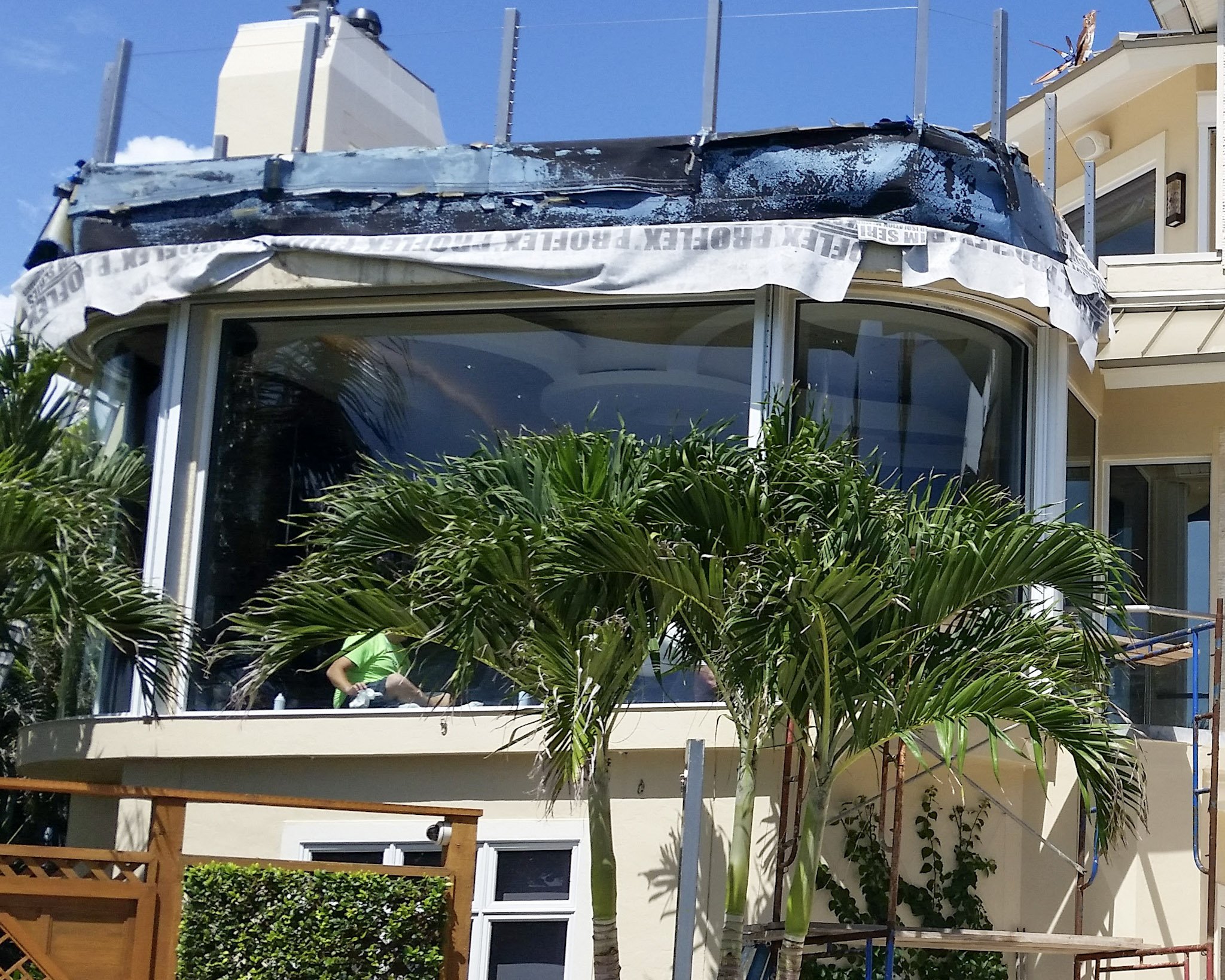 Curved glass installation and restoration on a Florida luxury residence — Glass Restoration Inc. serving new construction and renovation projects throughout the Gulf Coast.