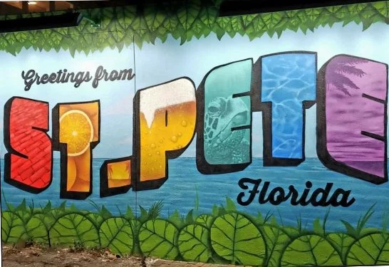 Glass Restoration specialist in St. Petersburg Florida featuring iconic Greetings from St. Pete mural for Pinellas County homeowners.
