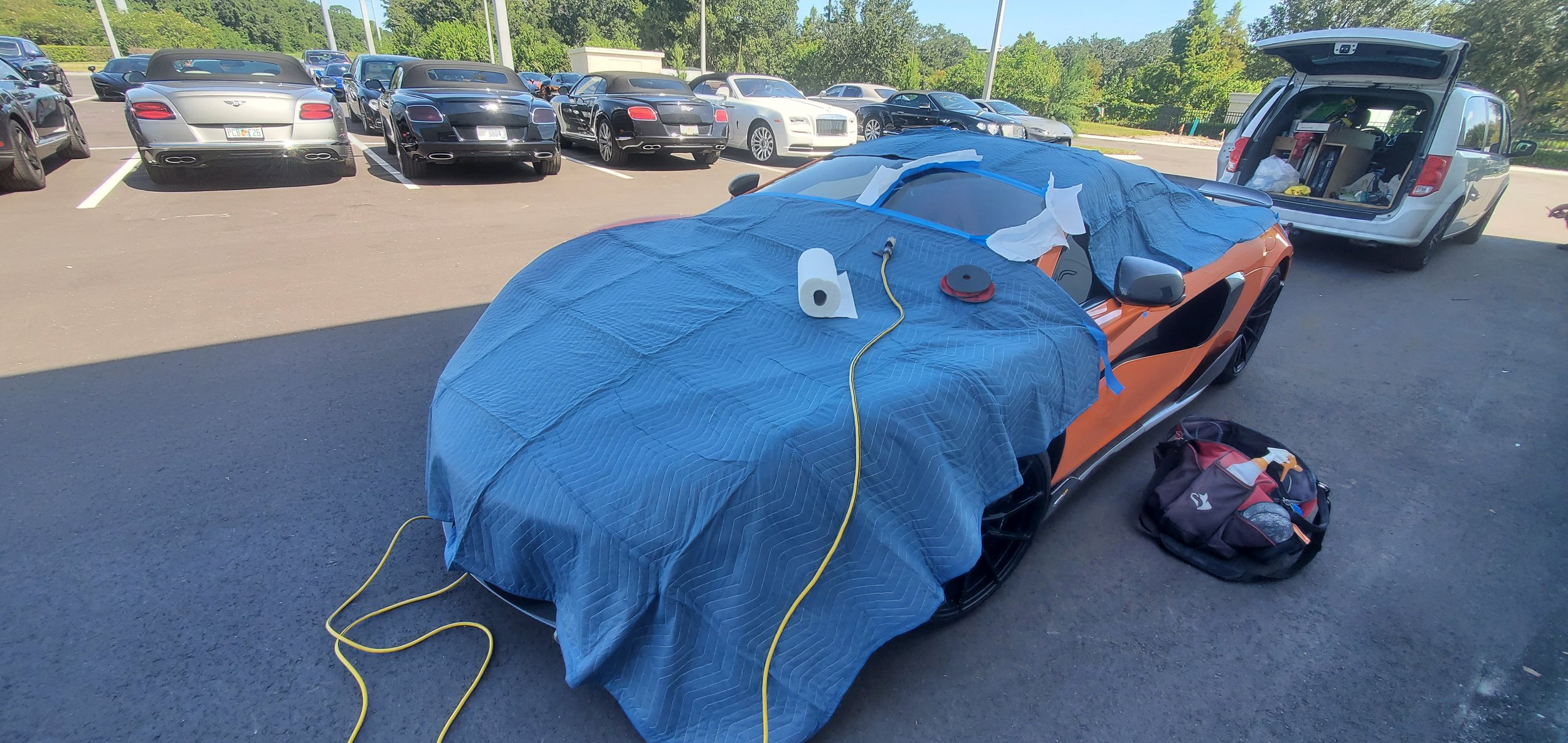 McLaren car scratched glass repair for the Dealership.