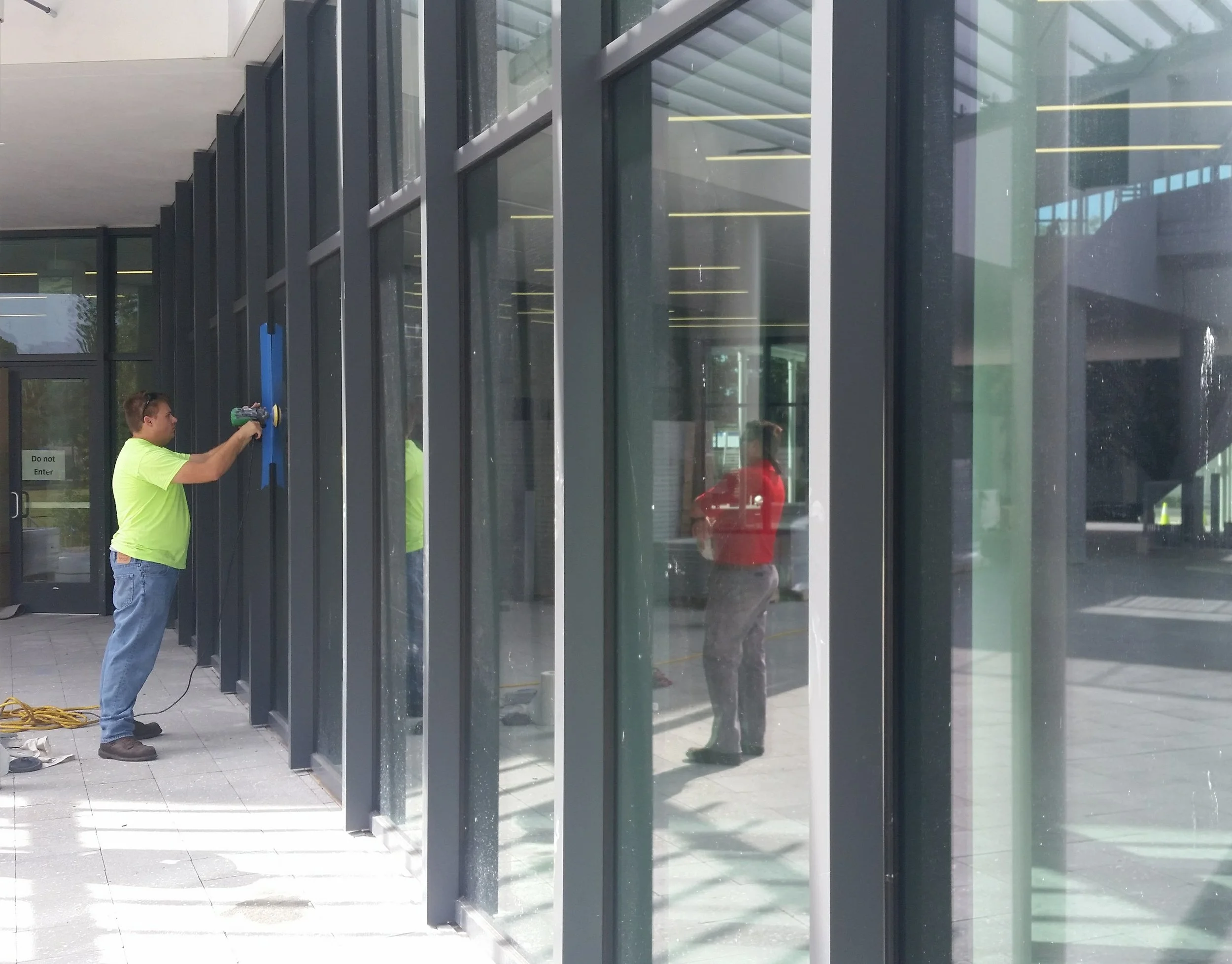 Several panels of this commercial building in Tampa had scratched glass that re repaied.