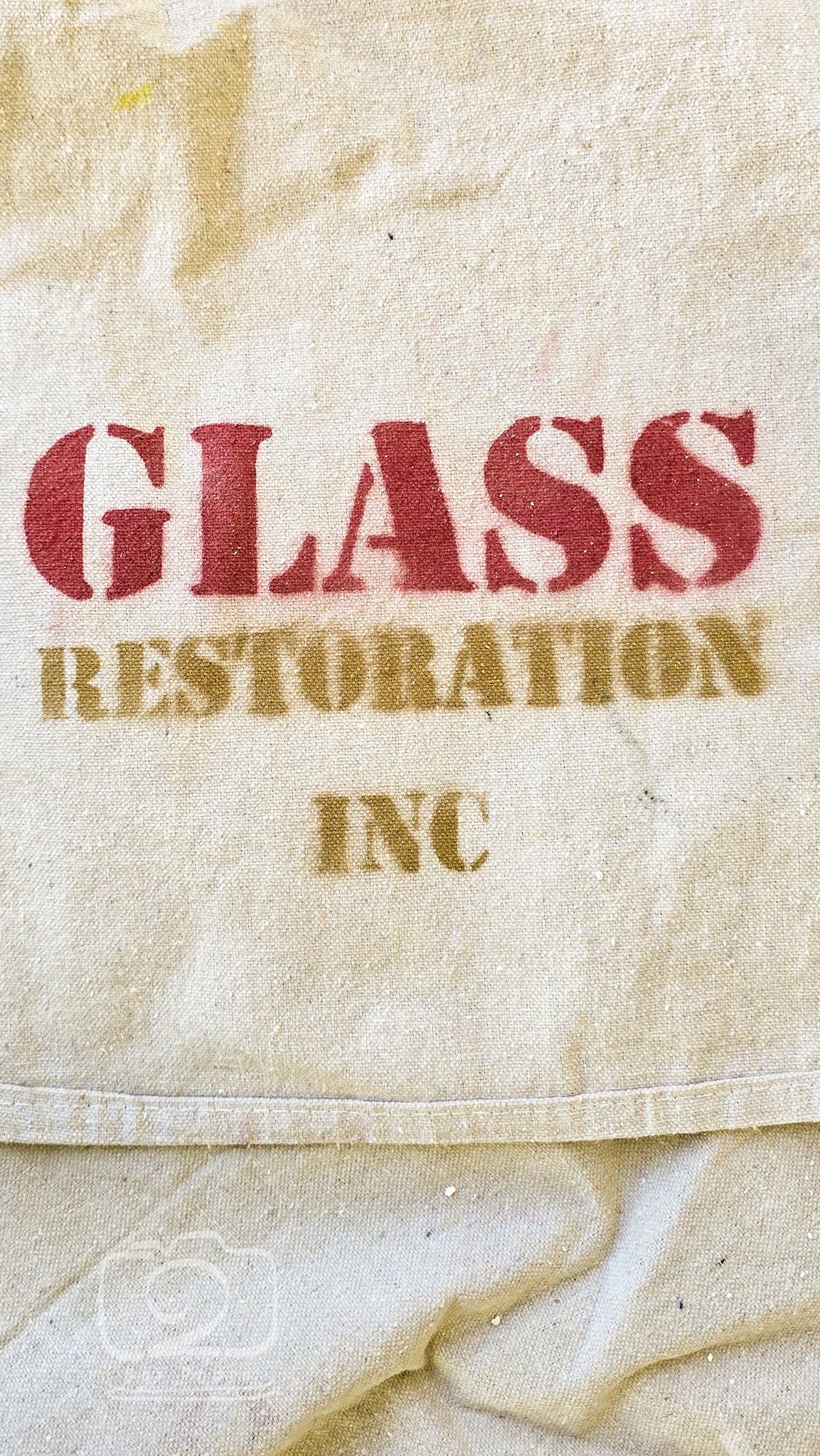 Dust Control during scratch removal on glass. Even our drop clothes are branded.