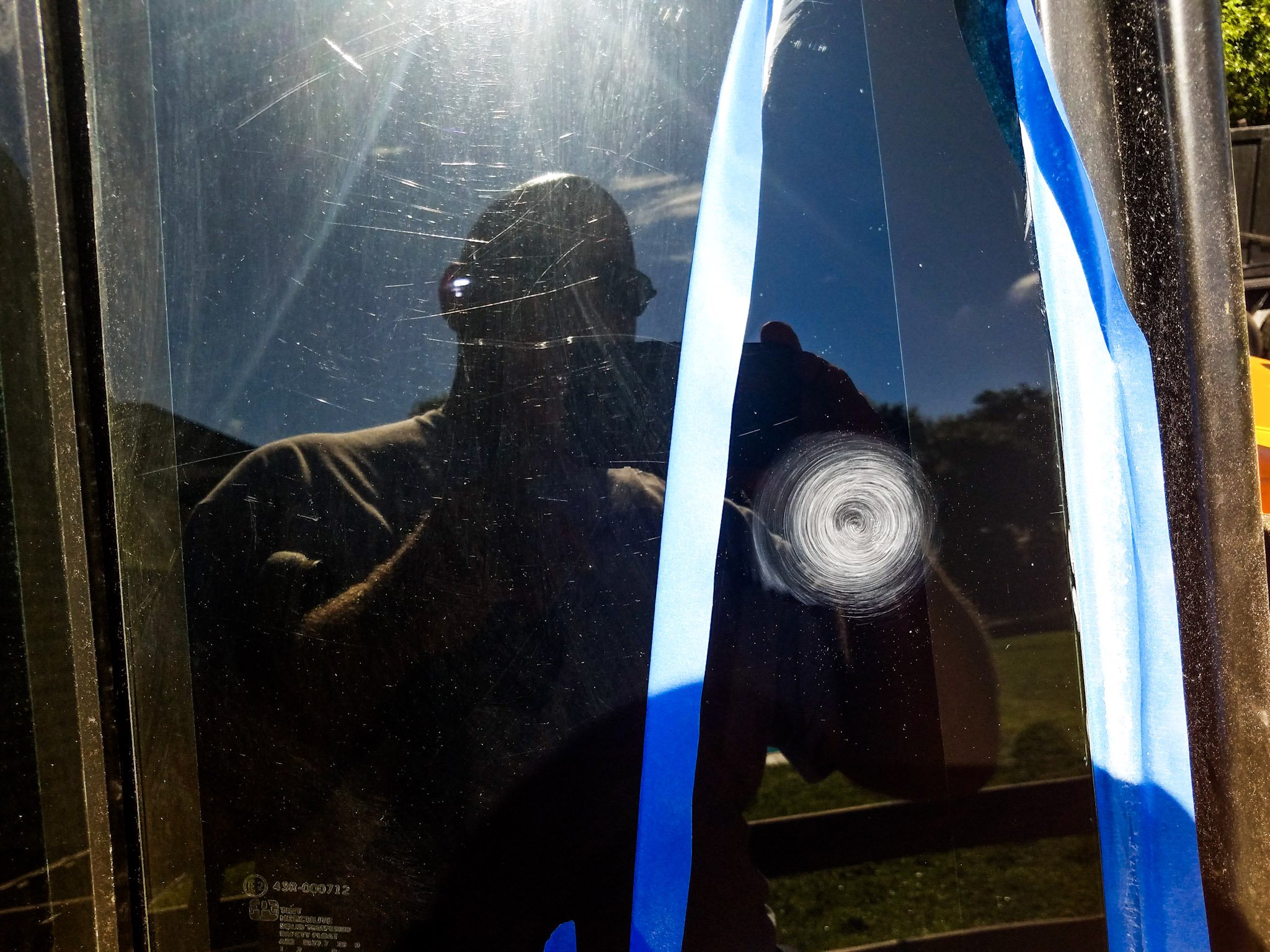 cell phone photo of scratched glass