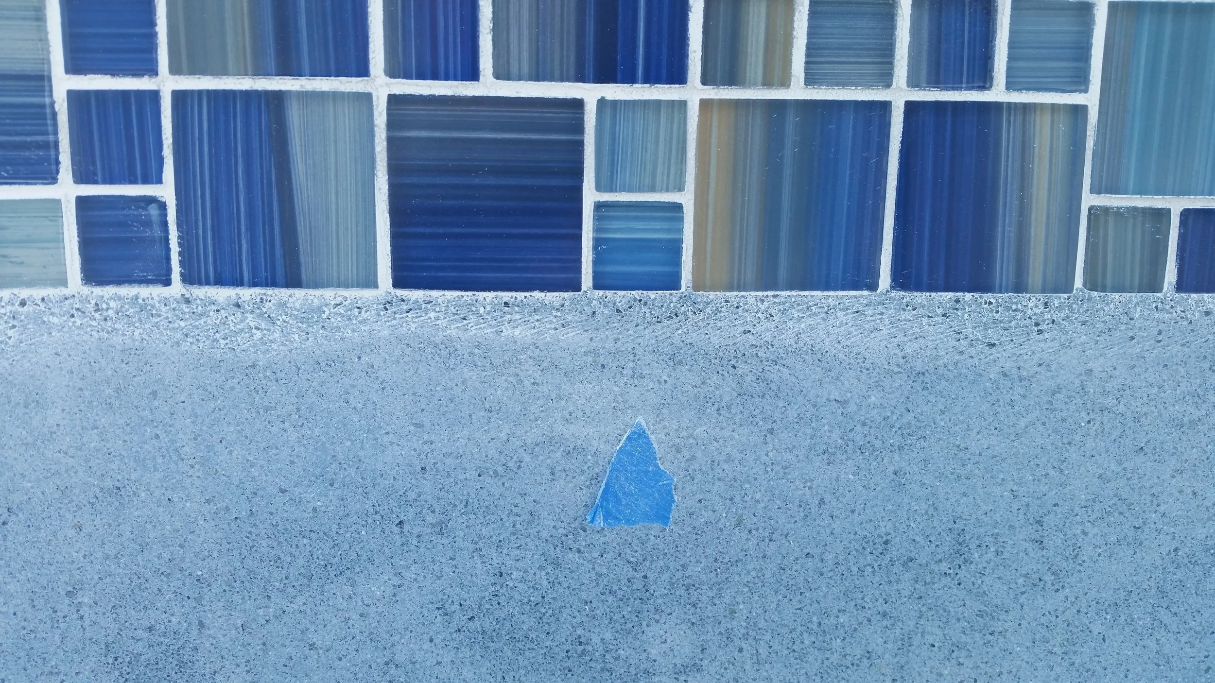 restored pool tile. Glass Restoration Inc polished the scratches out.