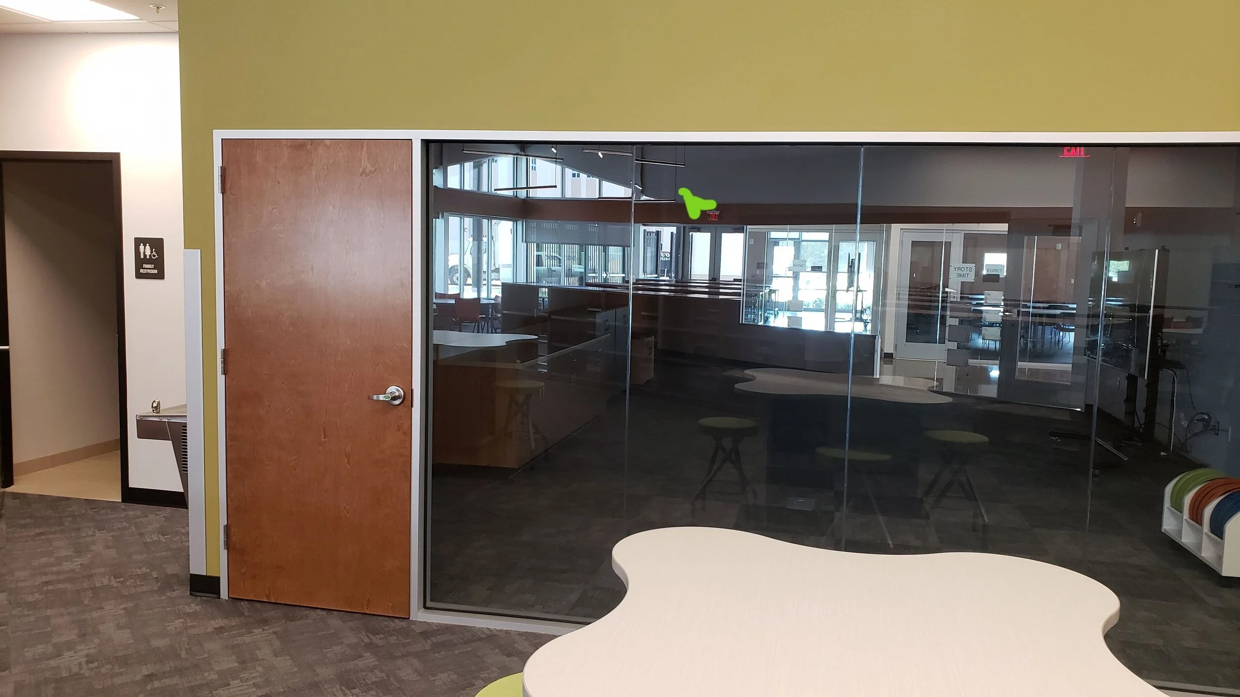 Restoring interior glass office partitions in a Lakewood Ranch corporate building; professional scratch removal and surface polishing for architectural glass walls.
