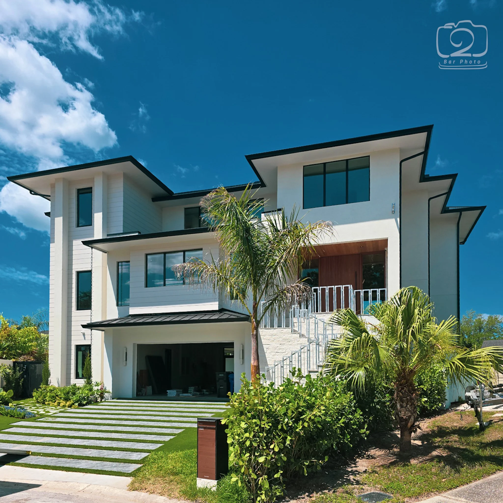 Large custom two story home glass scratch repair at Wild Blue at Waterside Lakewood Ranch FL — Glass Restoration Inc. the glass restoration specialists serving Neal Communities luxury lakefront estates in Manatee County