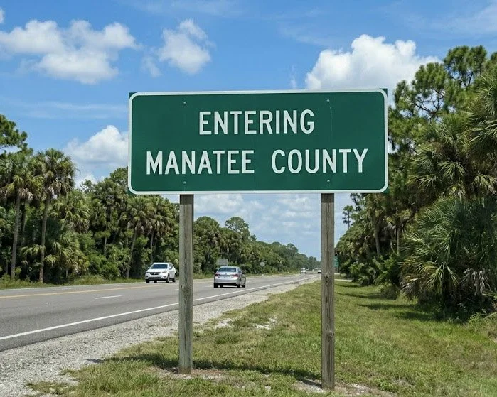 Entering Manatee County road sign representing glass restoration and scratch removal services for Bradenton, Lakewood Ranch, and Parrish.