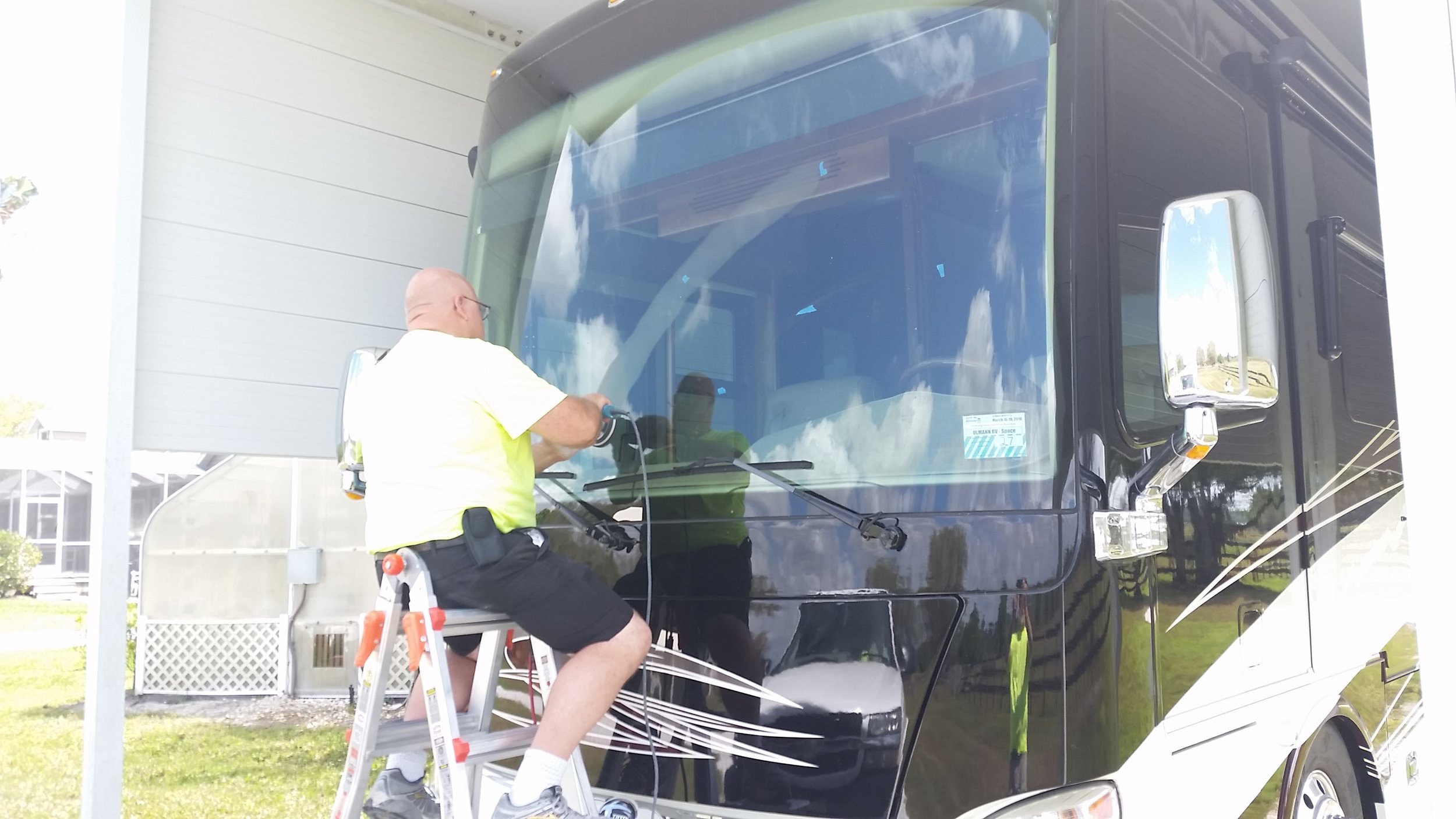 "On-site removal of a deep wiper scratch from a luxury motorcoach windshield—restoring perfect clarity without the $5,000+ cost of replacement."