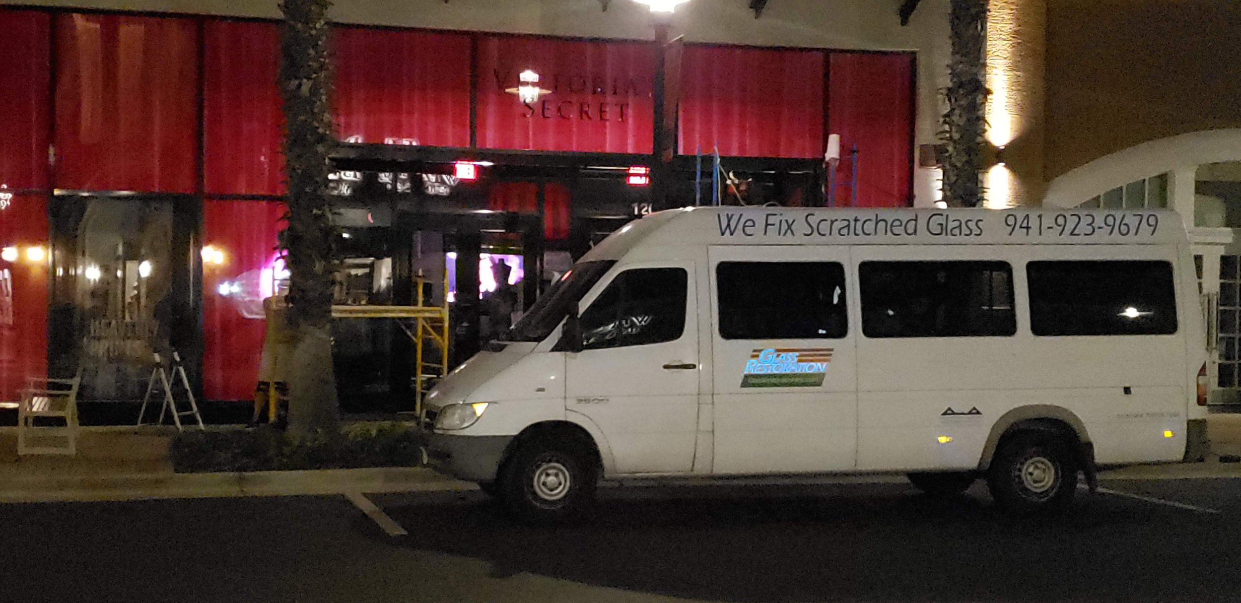 Glass Restoration Inc. service van outside a Victoria's Secret storefront in Wiregrass, Wesley Chapel, FL during an after-hours weld burn glass repair for a general contractor