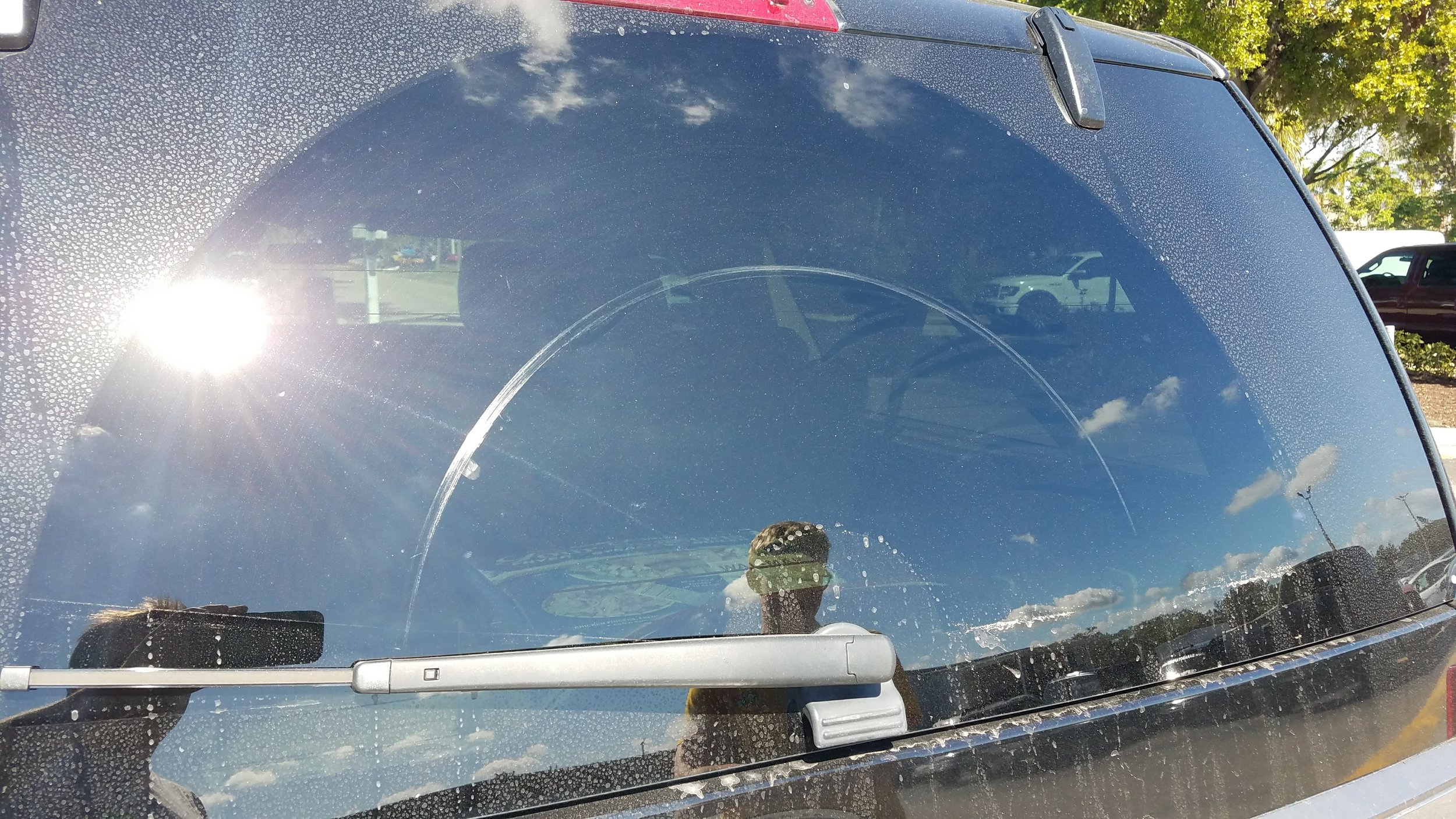 deep wiper scratches on back glass of a Ford