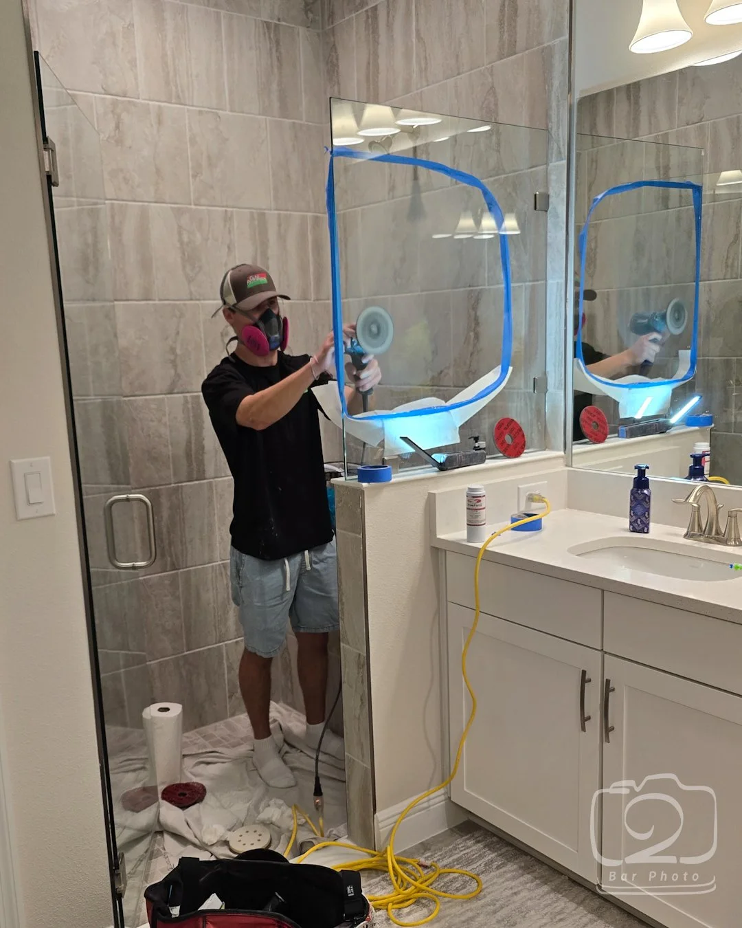 shower glass scratched during build. Glass Restoration Inc repairing scratched glass to Like New condition.