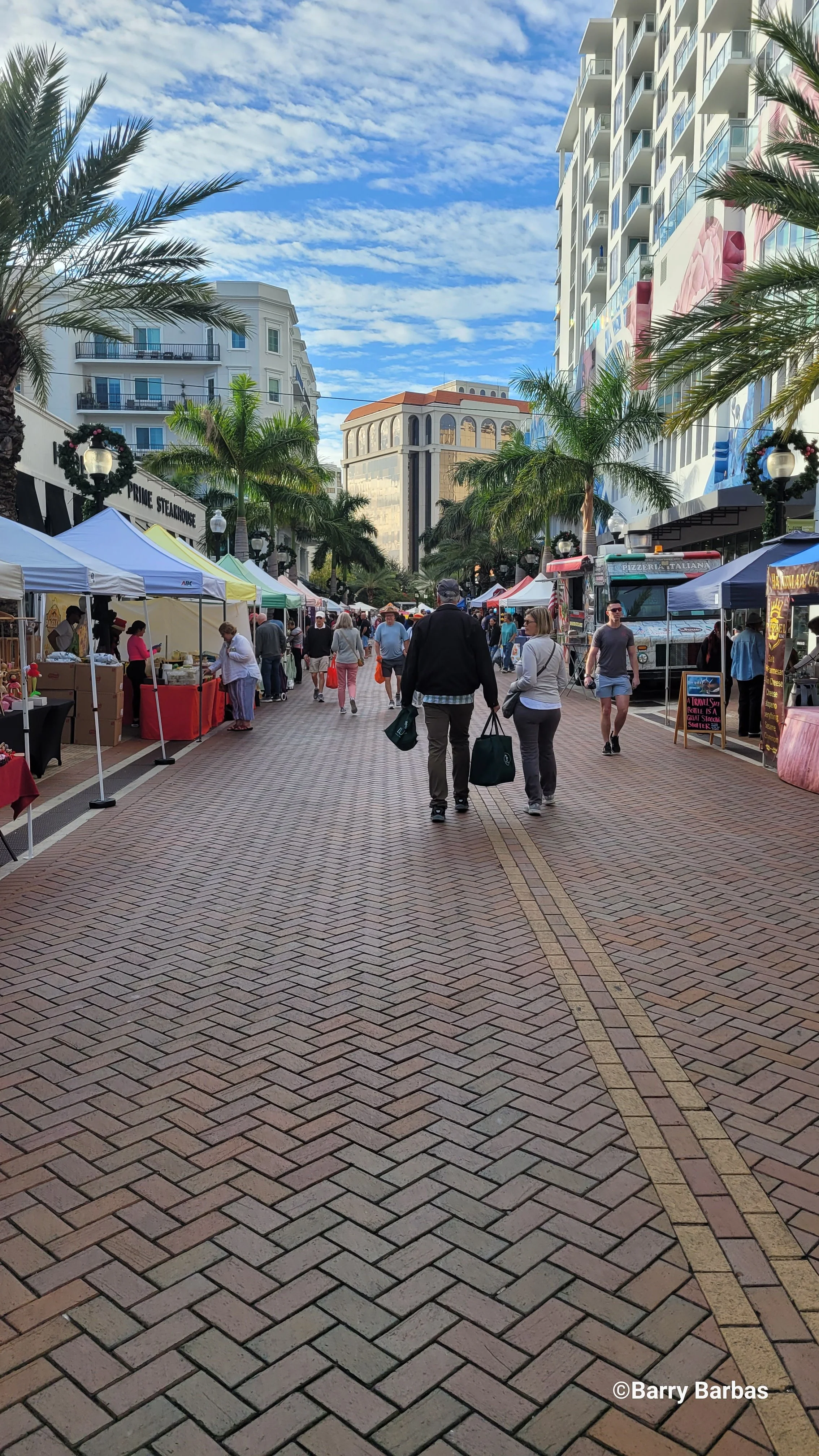 Downtown Sarasota Farmers Market on brick-paved Palm Avenue with luxury high-rise condominiums — Glass Restoration Inc. serves every downtown Sarasota bayfront residence