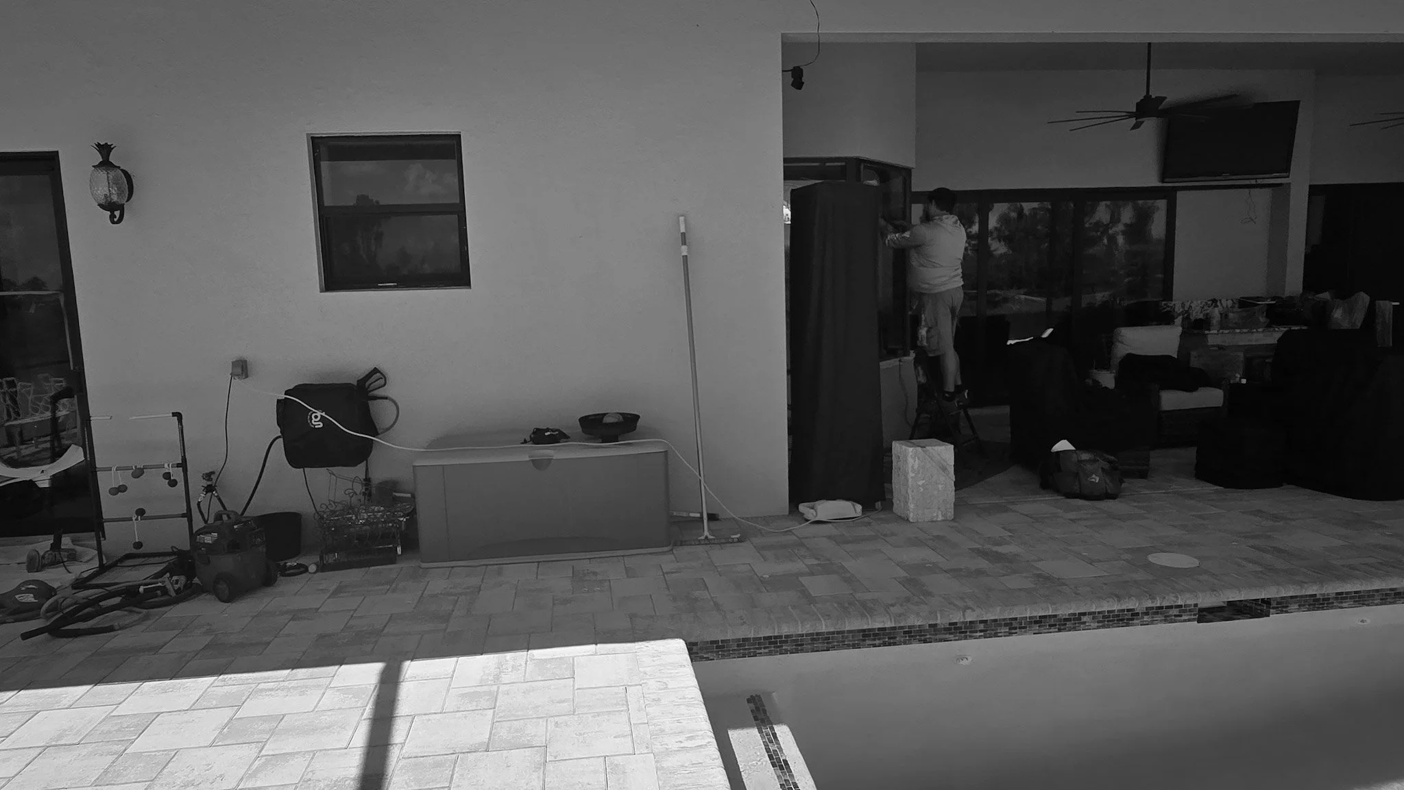 Hurricane-damaged glass restoration on Manasota Key, featuring deep scratch removal from storm debris and pool cage impacts by Glass Restoration Inc