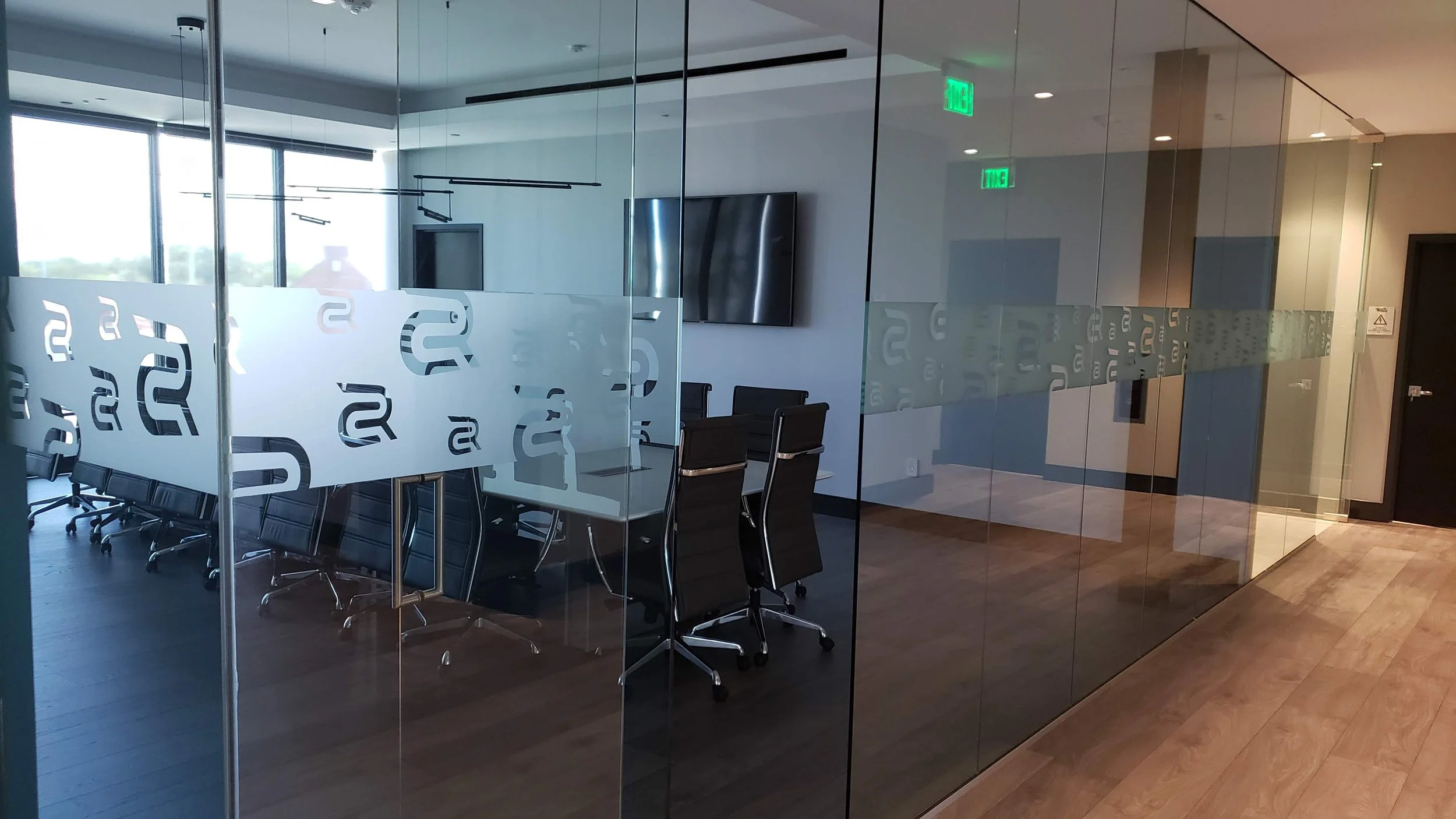 On-site scratch removal for glass office partitions in a Downtown Tampa high-rise; professional restoration of tempered glass walls without business downtime.