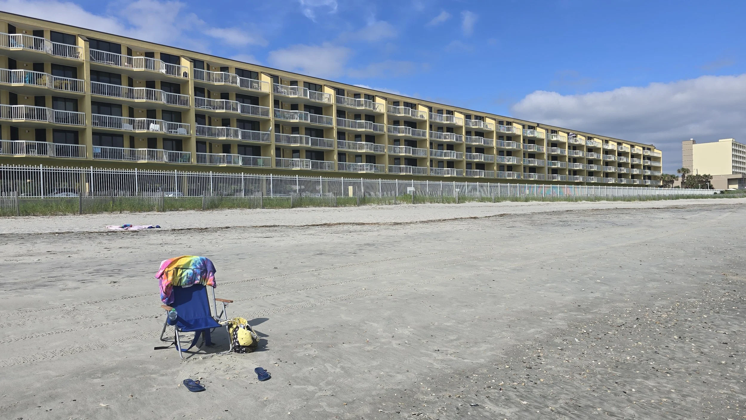 Charleston Oceanfront Villas at Folly Beach South Carolina viewed from the beach — verified national glass restoration engagement by Glass Restoration Inc. serving luxury coastal properties beyond the Florida Gulf Coast