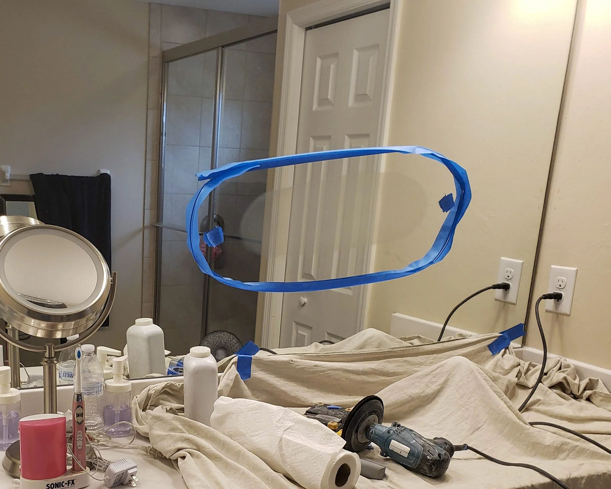 Scratched mirror at eye level. Difficult but not impossible repair.