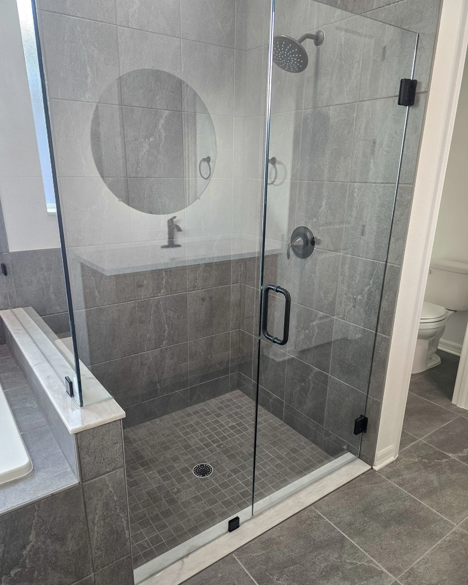 New shower in custom home had 4 scratches on the shower glass repaired, We polished out the scratches to make it look new again.