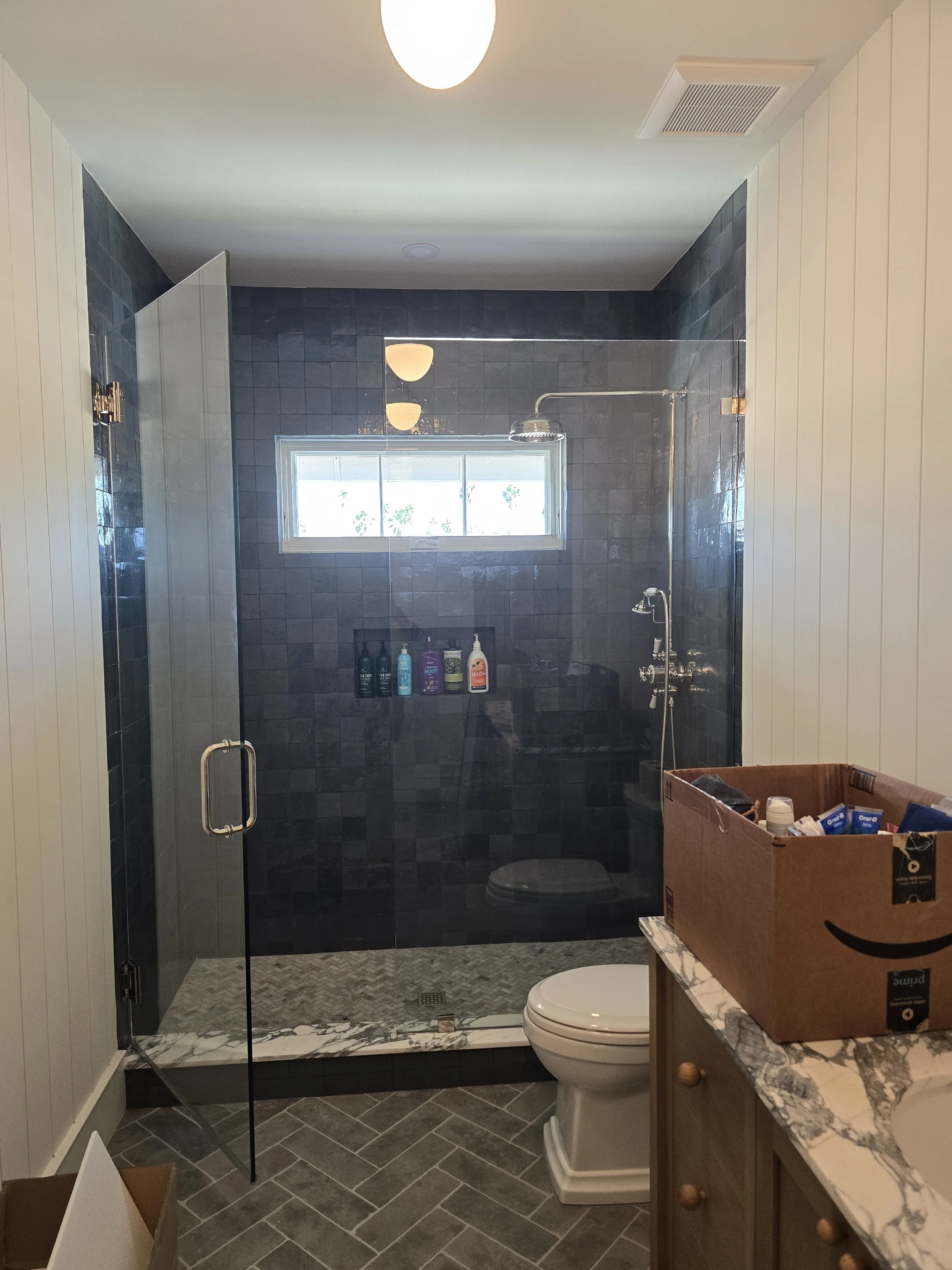 Glass scratch repair on a custom frameless shower enclosure at The Pearl Sarasota, Golden Gate Point downtown Sarasota FL — Glass Restoration Inc.