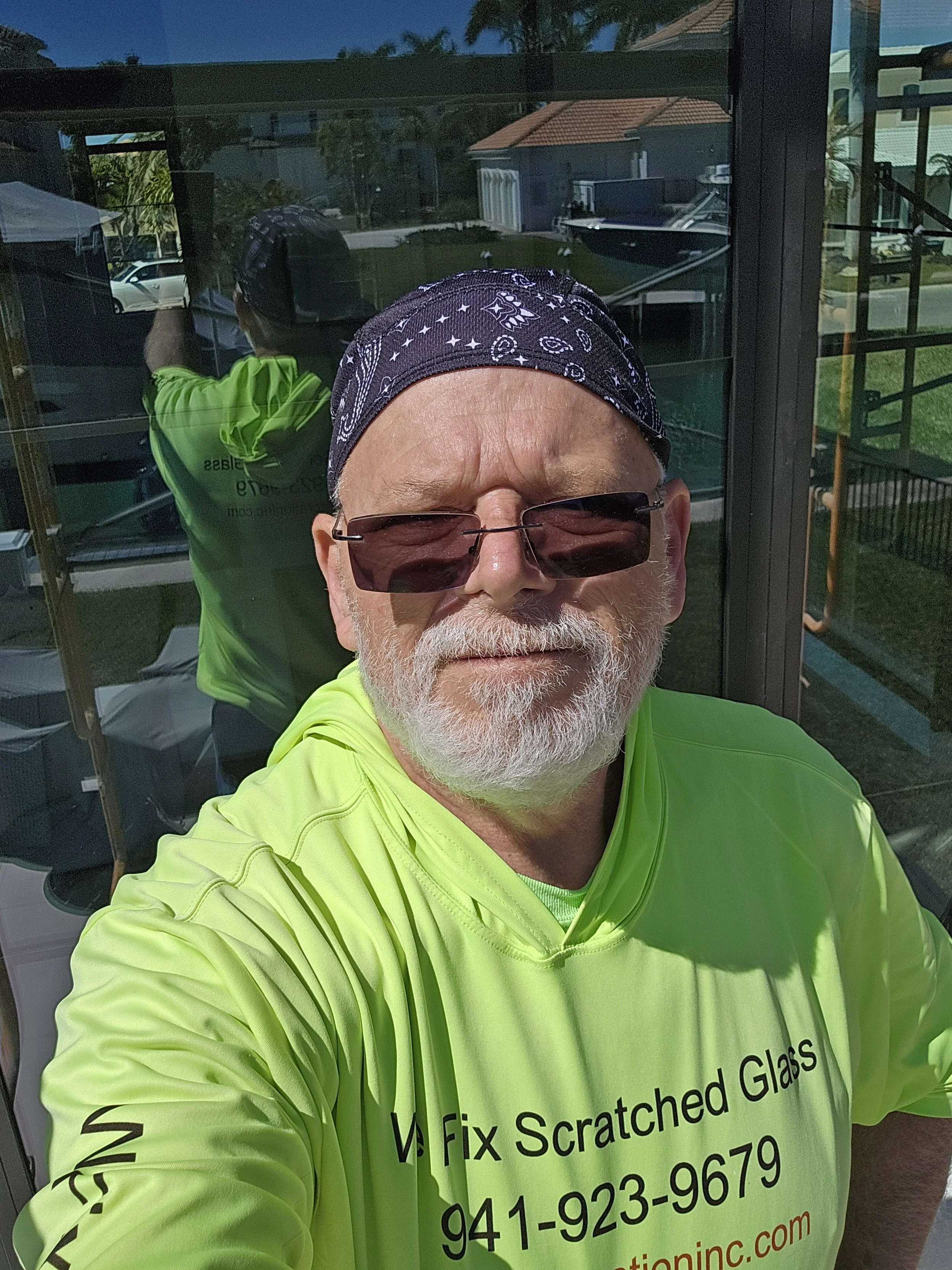 Barry Barbas of Glass Restoration Inc. working on-site at a Glen Lakes Spring Hill FL glass restoration job — hands-on artisan craftsmanship on every project regardless of complexity