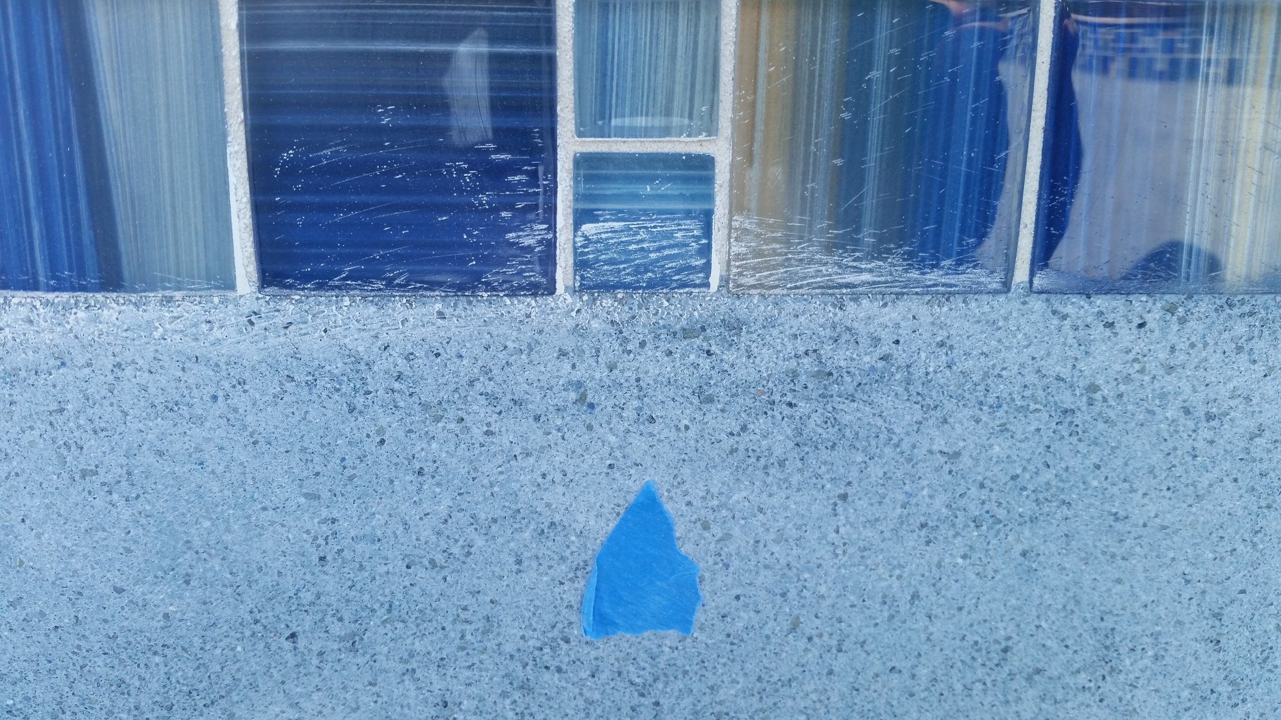 scratched pool tile before our scratch removal