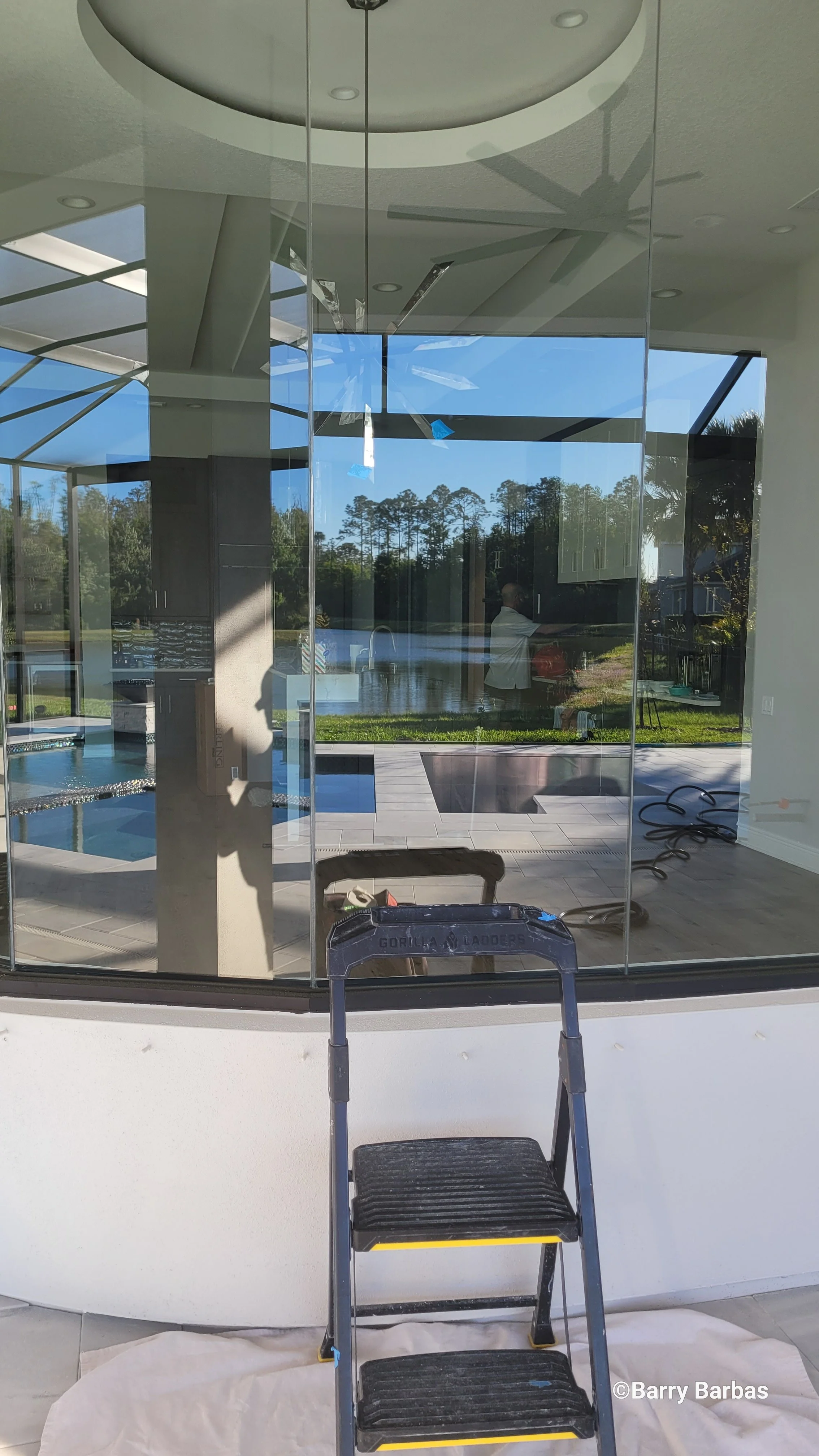 Radius layout butt glass window scratch repair in Tarpon Springs Florida — artisan glass restoration by Glass Restoration Inc. on architectural curved glass installation