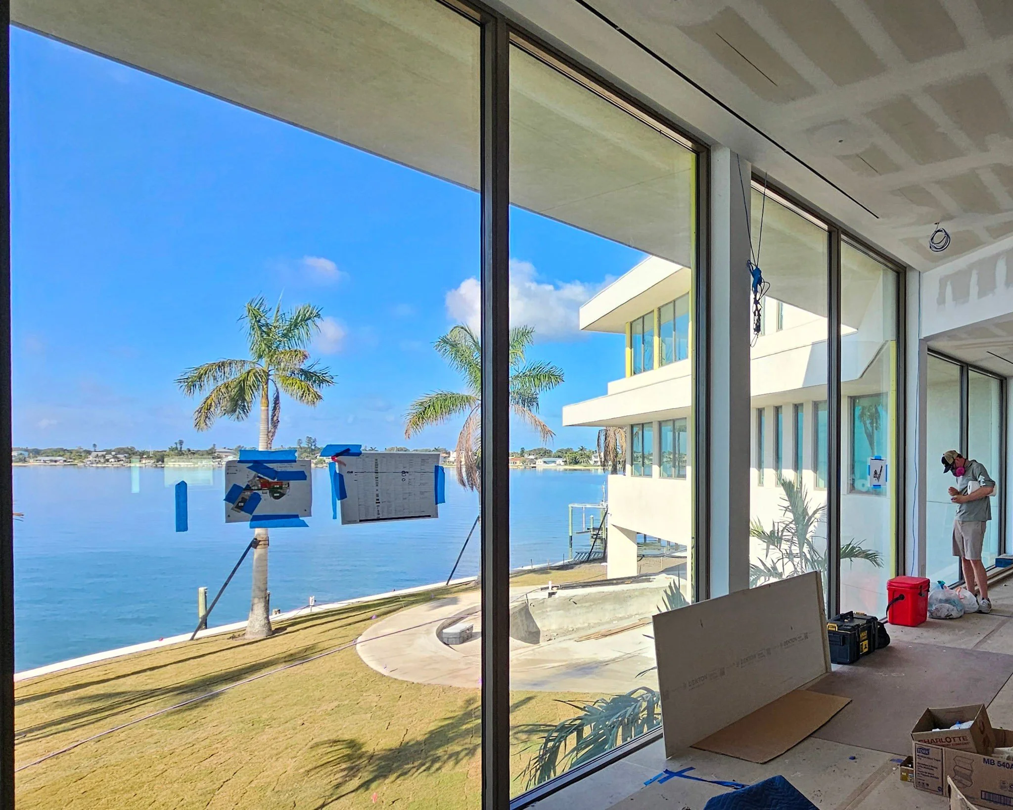 The Owen Golden Gate Point Sarasota at 498 Golden Gate Point — 29 luxury residences with full-height windows and glass-railed balconies, glass scratch repair by Glass Restoration Inc.