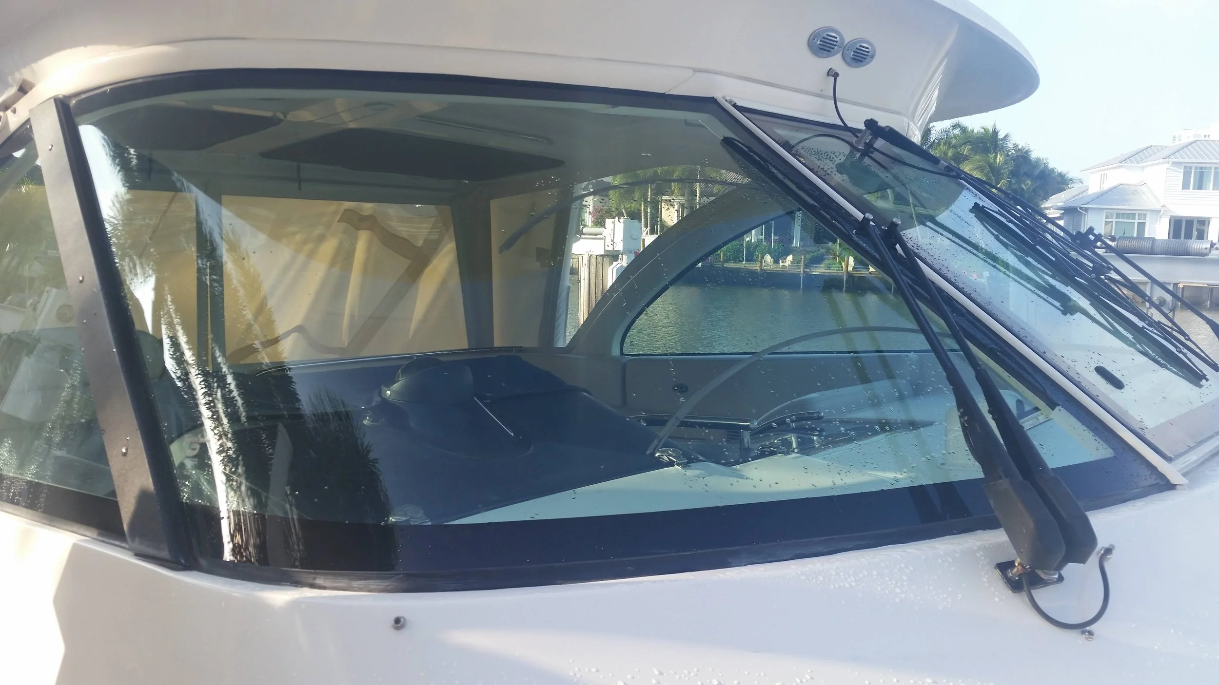 Yacht windshield wiper scratch repair by Glass Restoration Inc. — deep wiper arc scratches removed to factory clarity on a boat windshield serving The Inlets Bradenton FL and the Gulf Coast boating community