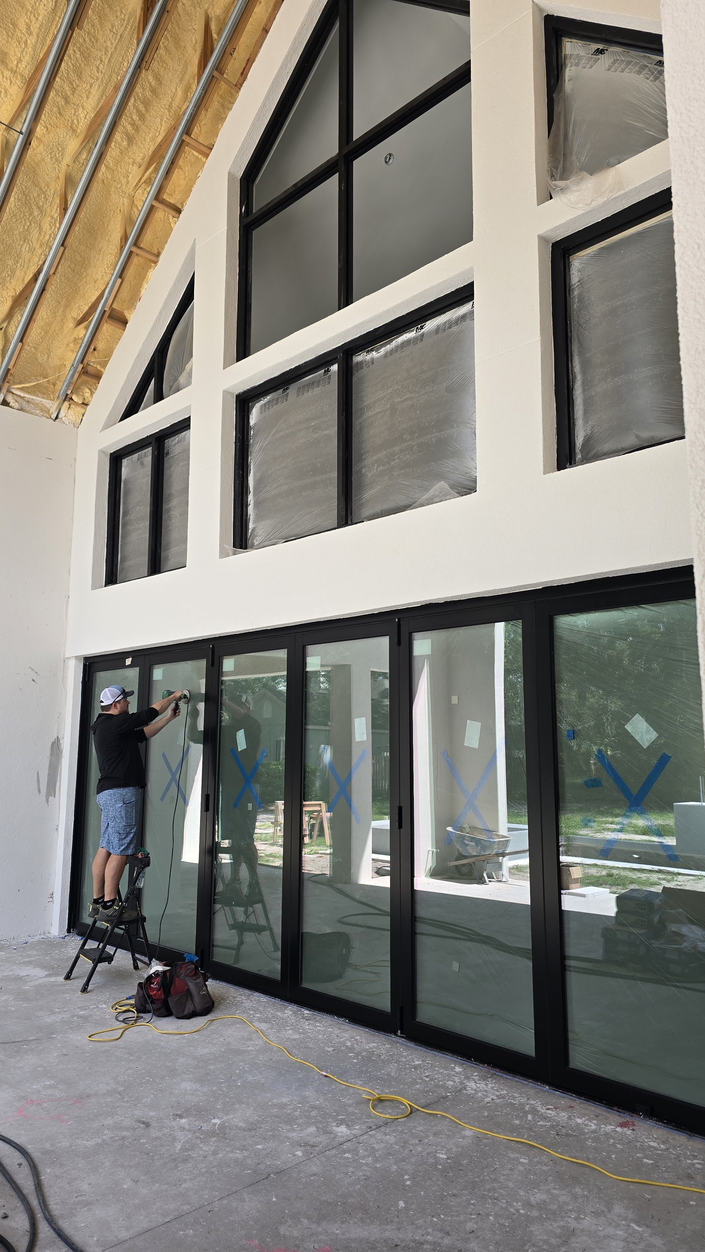 Large home in Tampa with several panels of Hurricane glass scratched. We fix scratched glass in Tampa. Glass Restoration Inc.