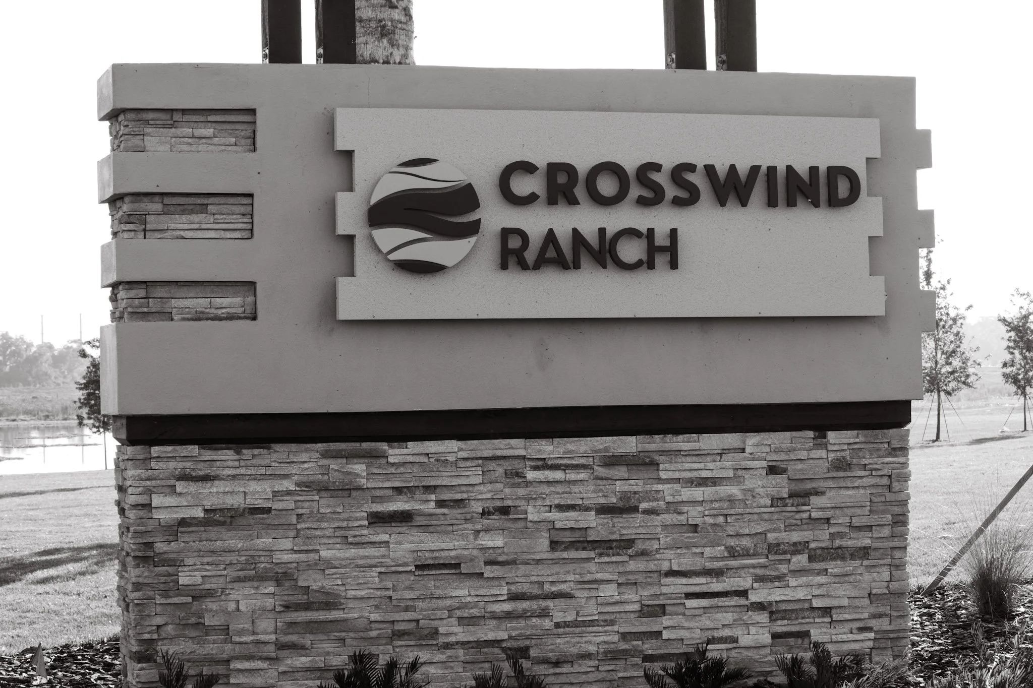 Crosswind Ranch subdivision sign in Parrish FL — Glass Restoration Inc. serves this Homes by WestBay community in Manatee County with on-site glass scratch repair and restoration
