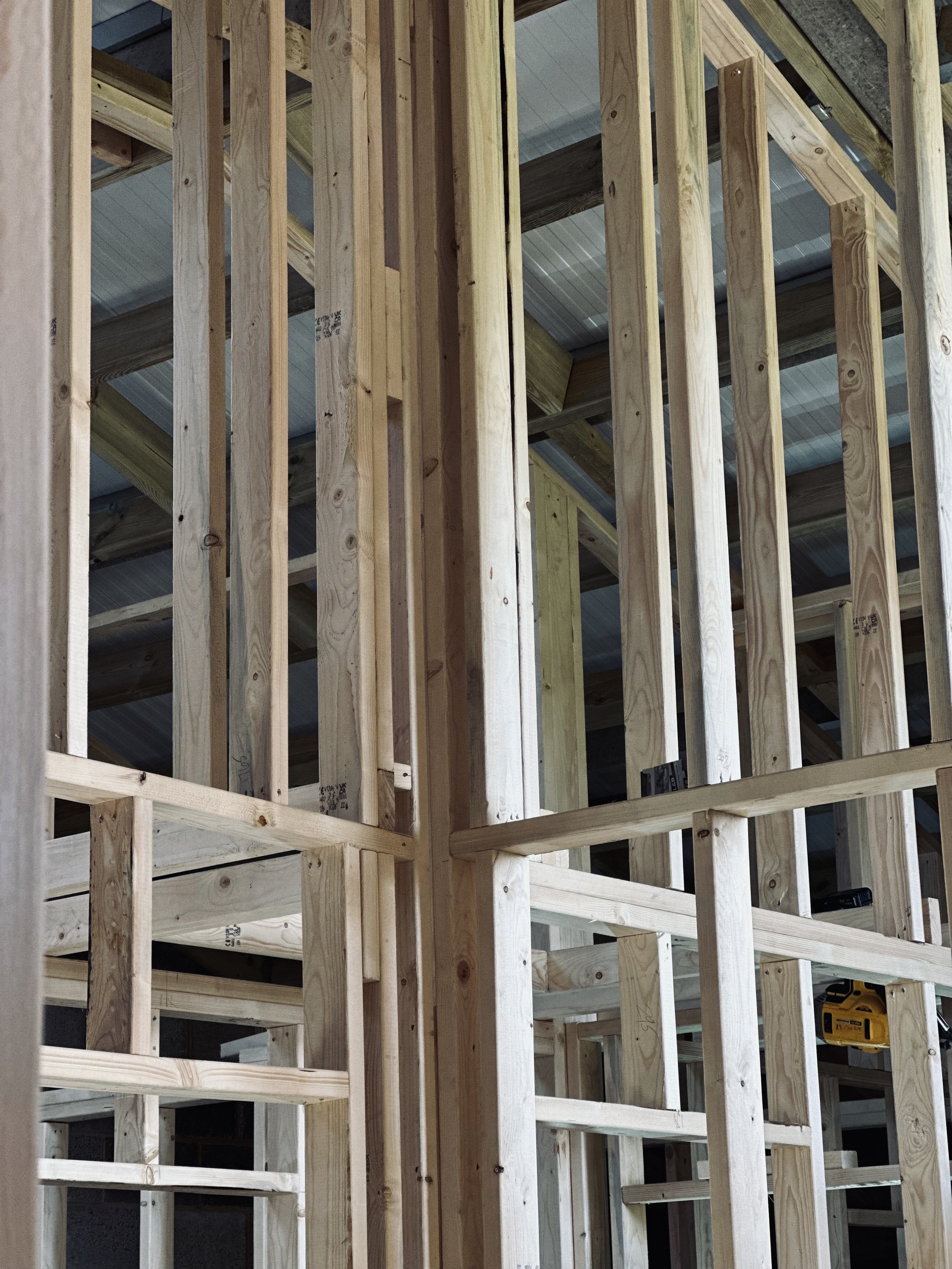 Wooden framing structure of a building under construction.