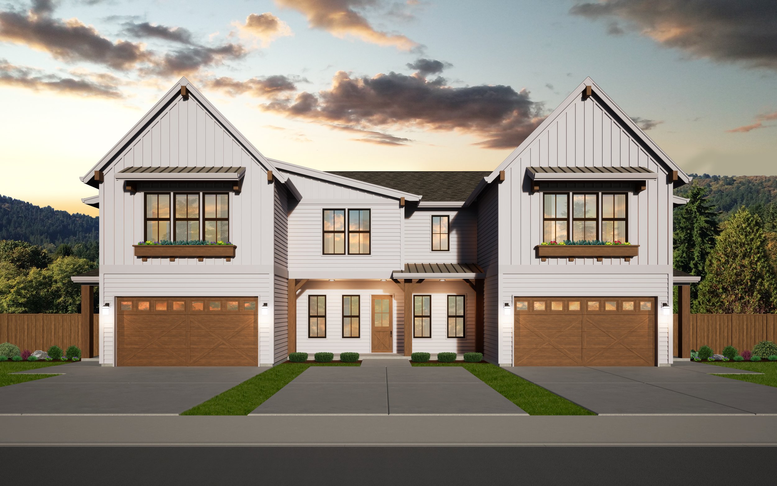 Modern duplex house exterior with two garages and white siding at sunset with a cloudy sky.