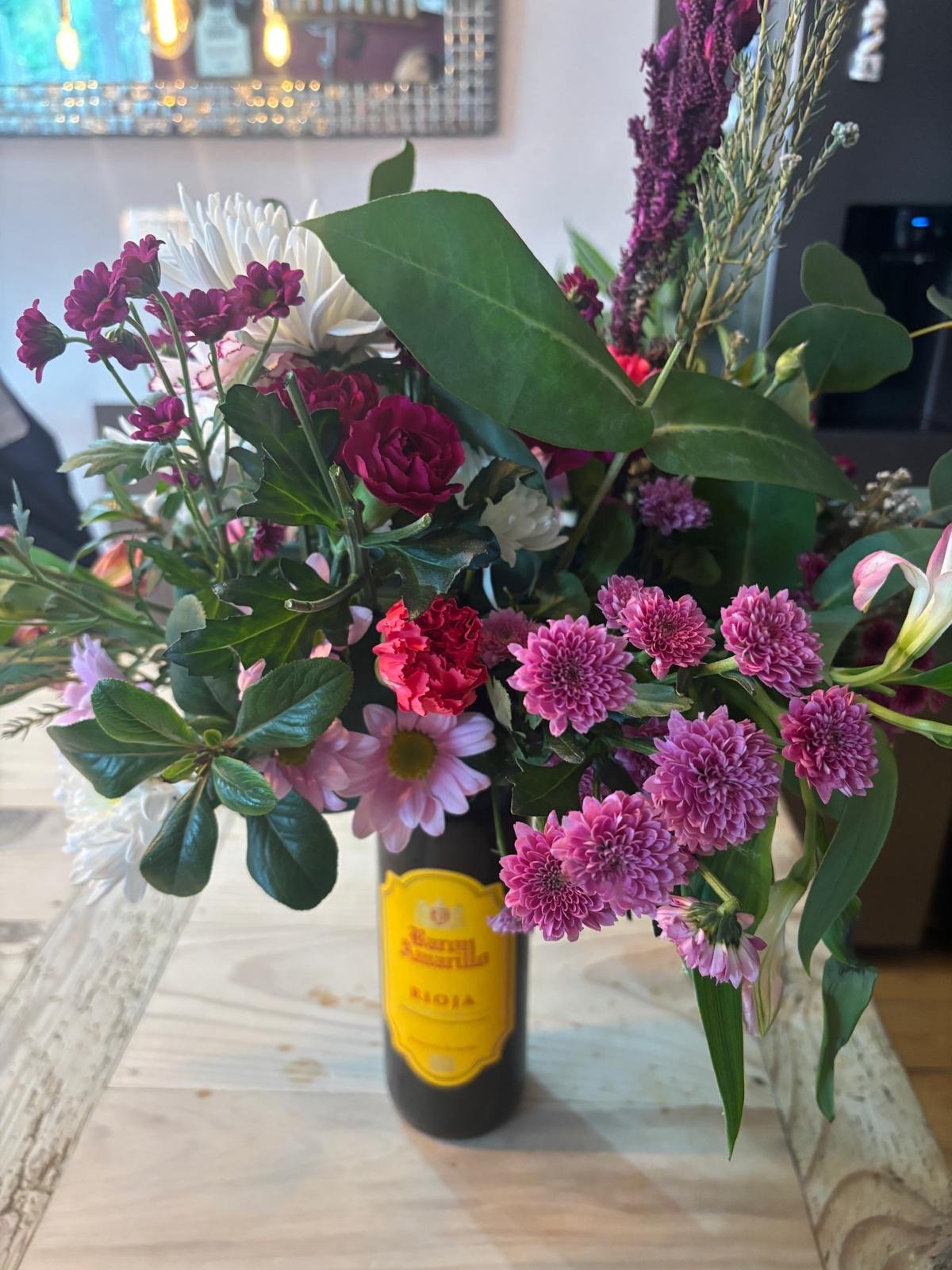 a floral bottle topper