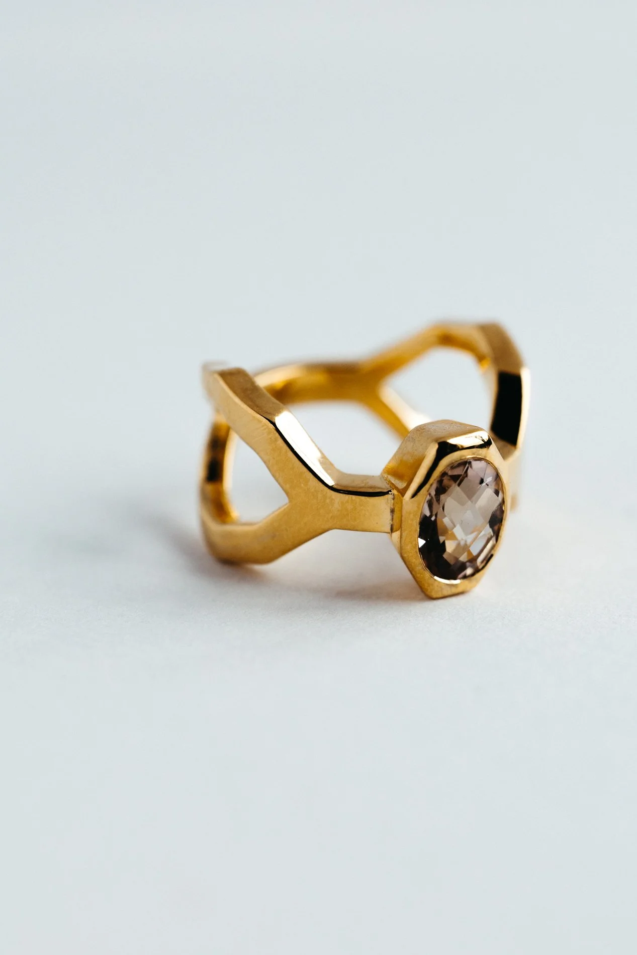 Particles ring V4.2 by Sajfrt — skewed architectural form in silver or gold, set with morganite or green tourmaline. Designed and made in Belgium.
