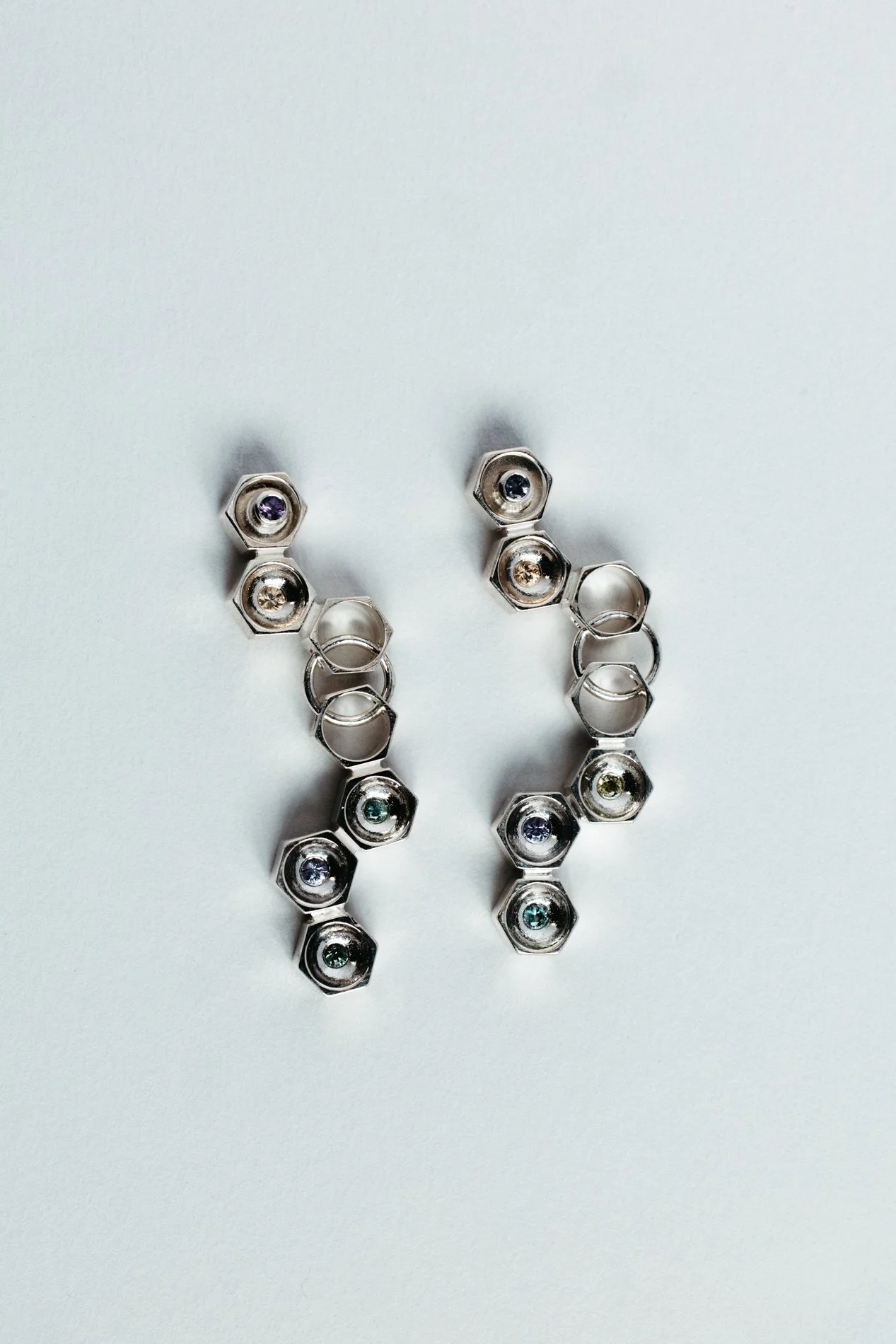 Particles family long earrings V1.2 by Sajfrt — handcrafted in Belgium with silver or gold, and stones including sapphires, diamonds, and tourmalines.