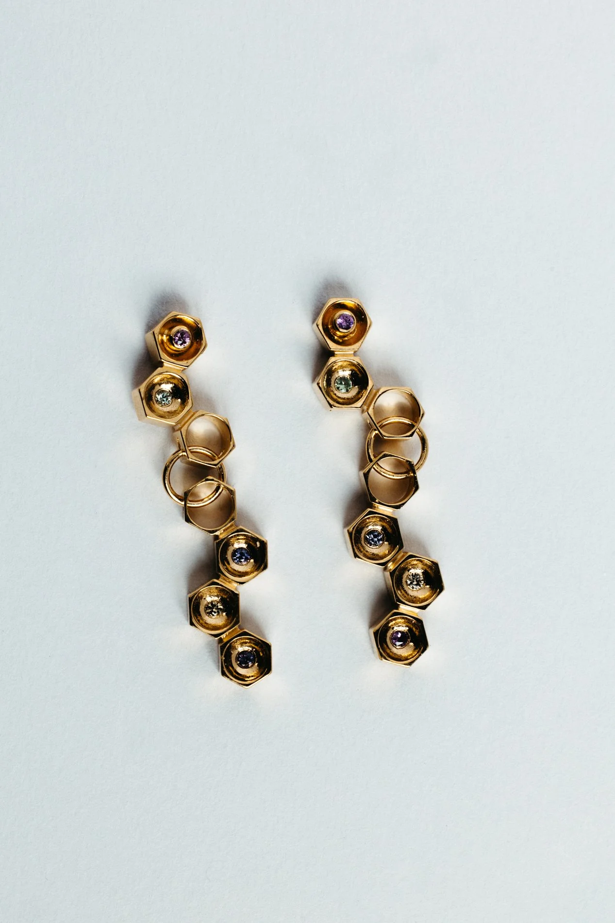 Particles family long earrings V1.2 by Sajfrt — handcrafted in Belgium with silver or gold, and stones including sapphires, diamonds, and tourmalines.