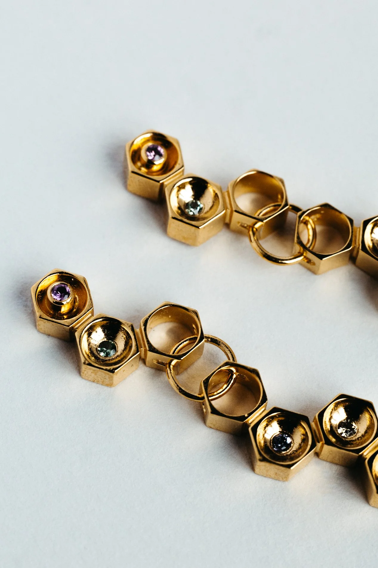 Particles family long earrings V1.2 by Sajfrt — handcrafted in Belgium with silver or gold, and stones including sapphires, diamonds, and tourmalines.