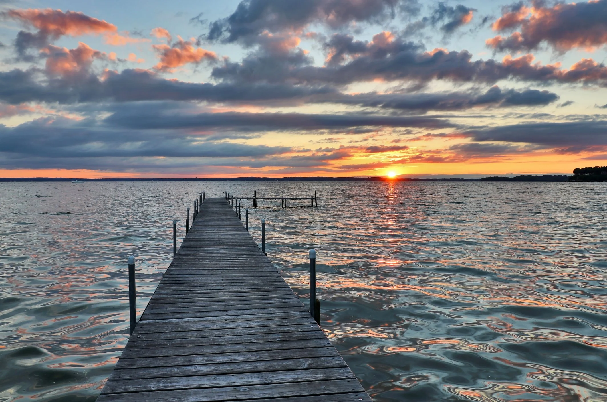 Sunset view from a wooden dock on Lake Mendota, Wisconsin